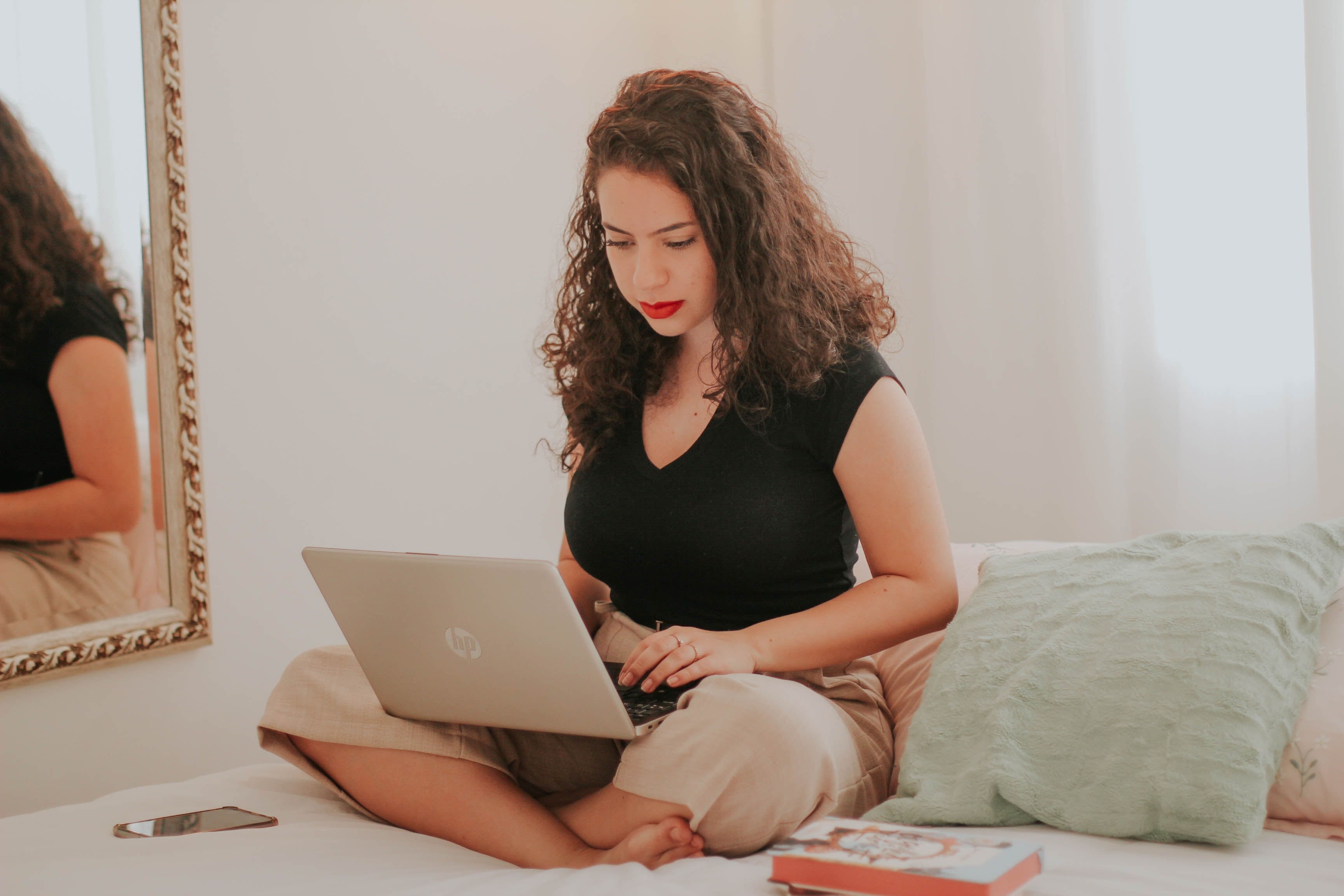 woman working on apple laptop from home