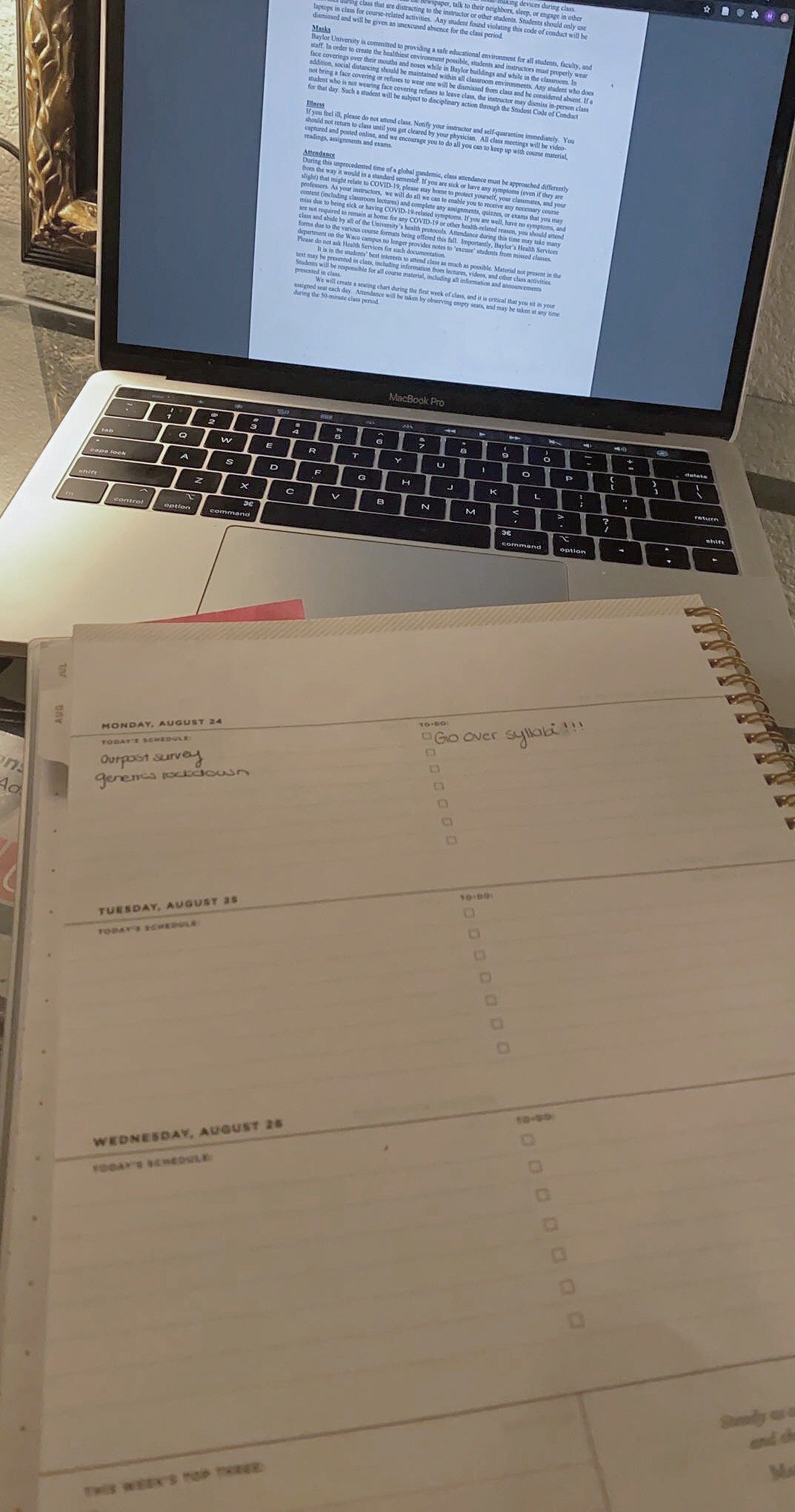 Student\'s planner in front of a computer