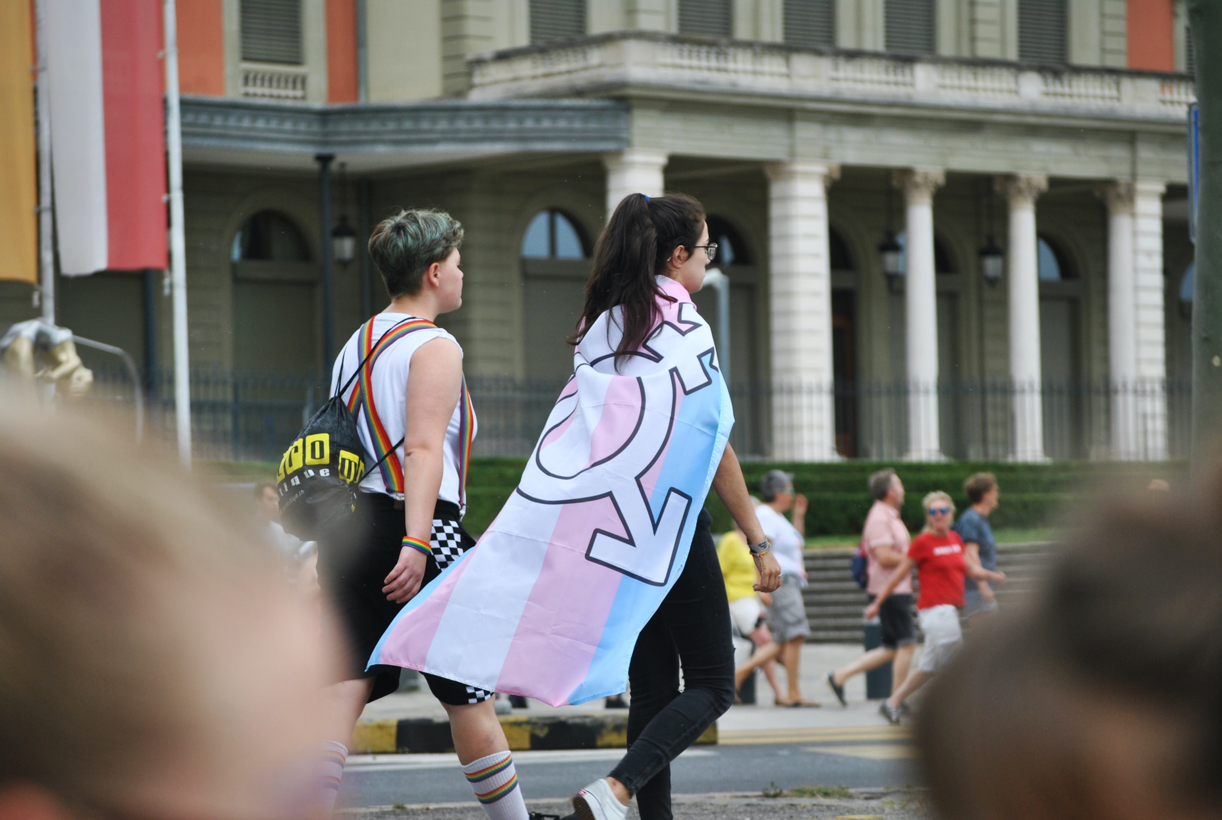 Person wearing trans pride flag by Delia Giandeini?width=698&height=466&fit=crop&auto=webp&dpr=4