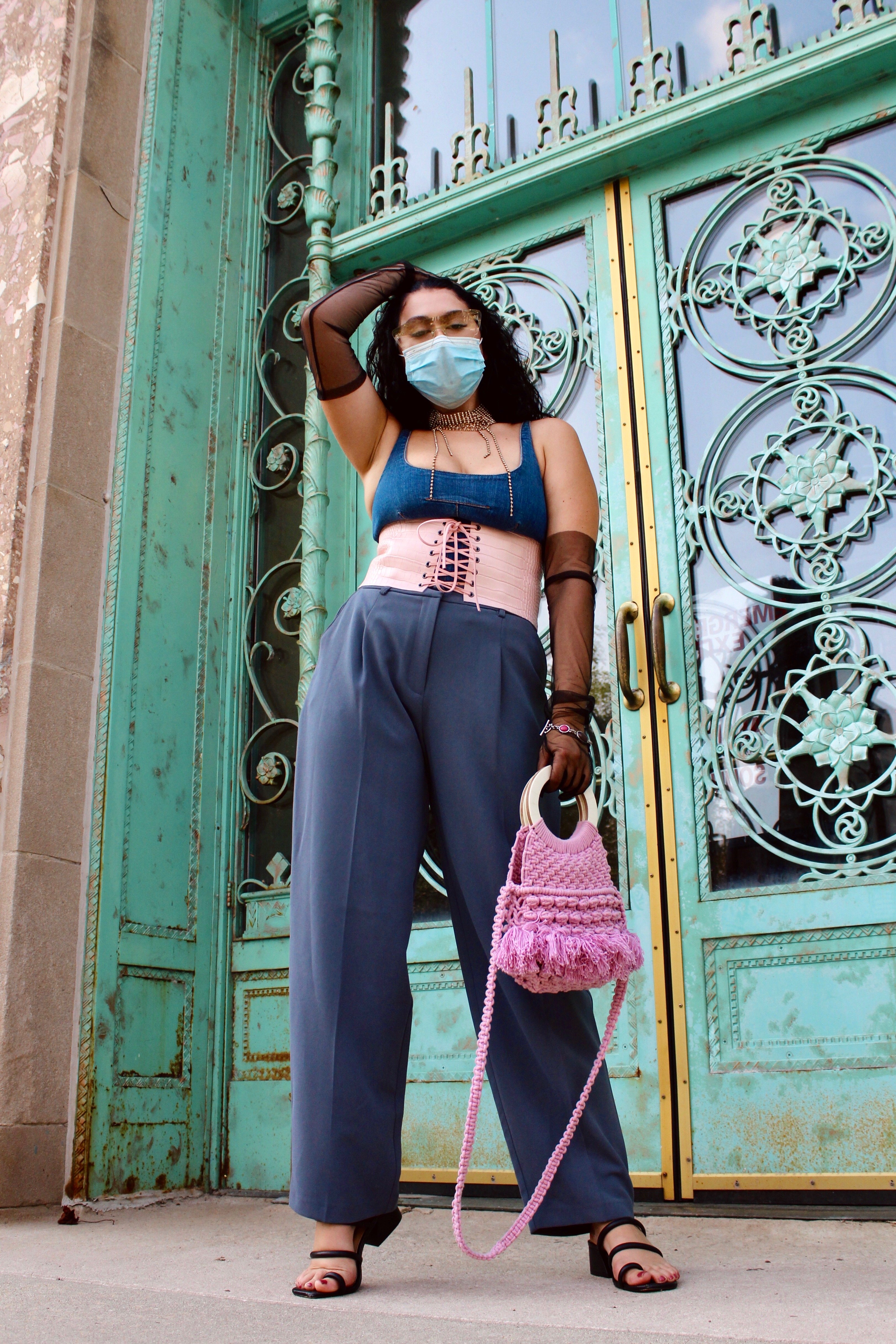 Model poses in front of building