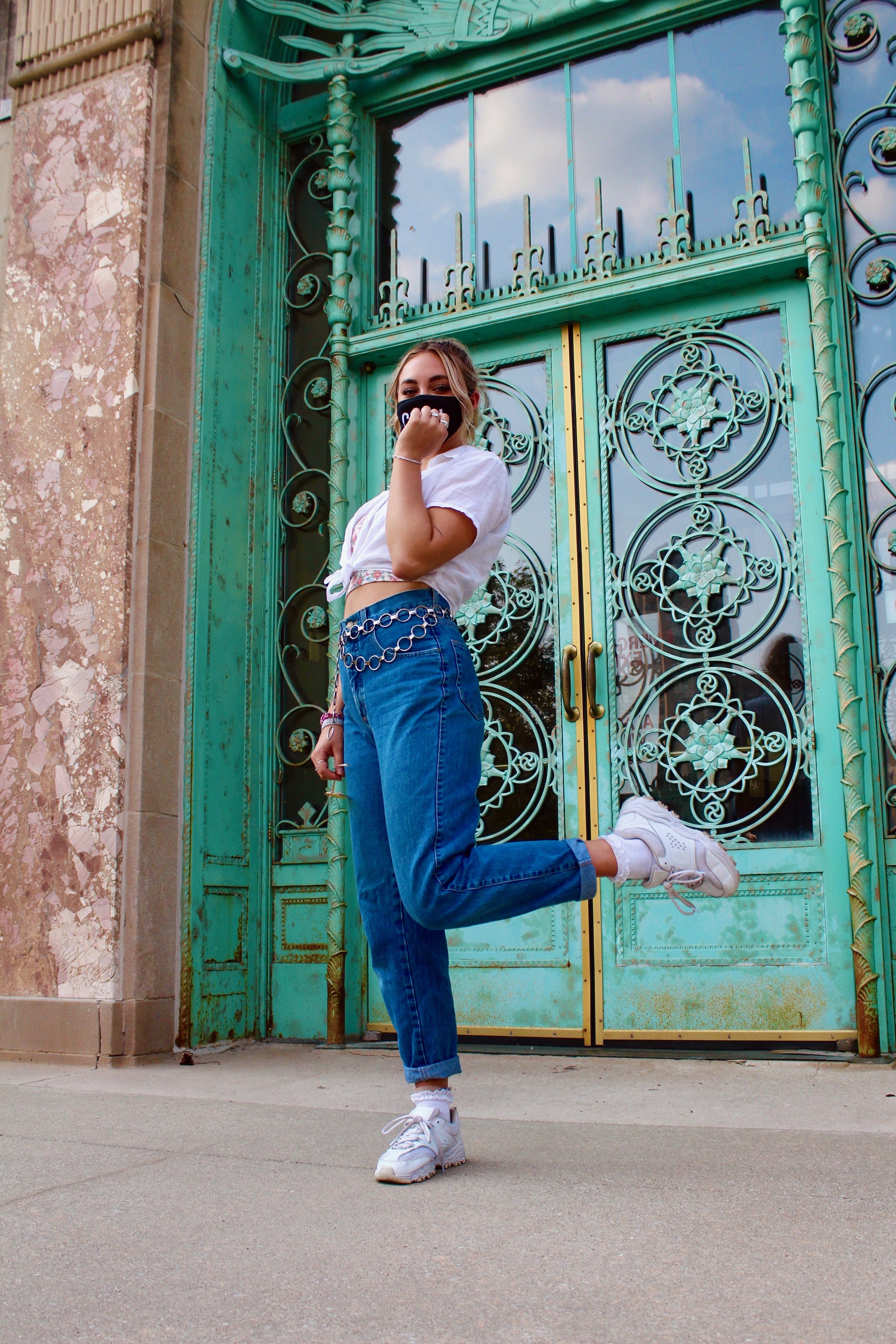 Model poses in front of building