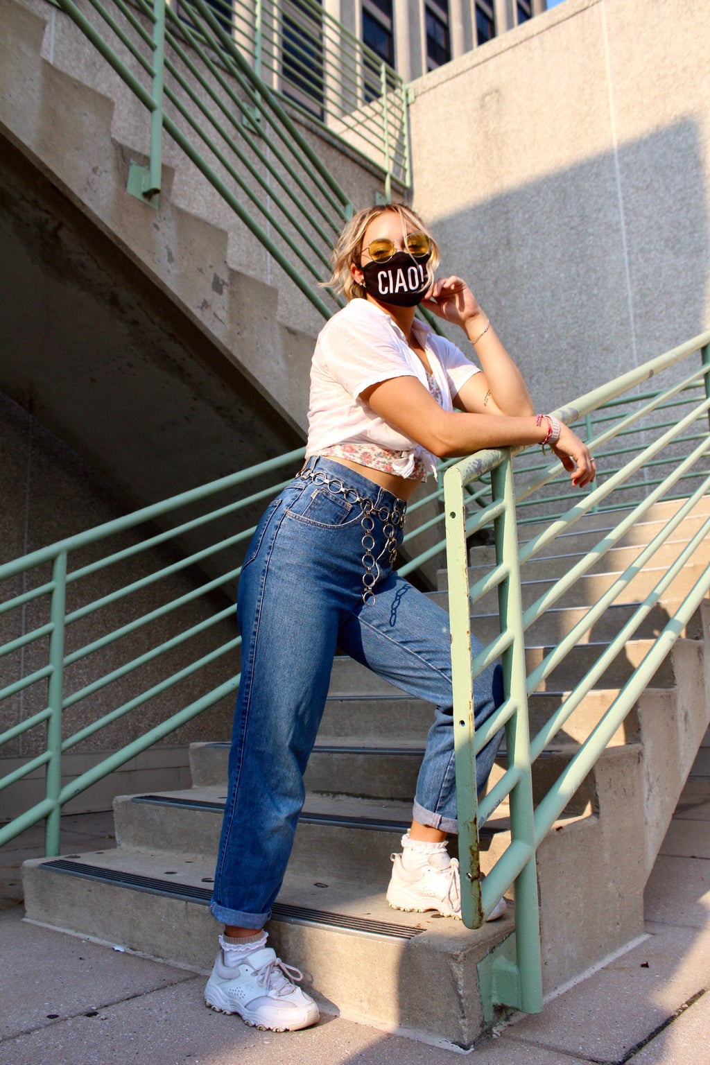Model poses over stair railing