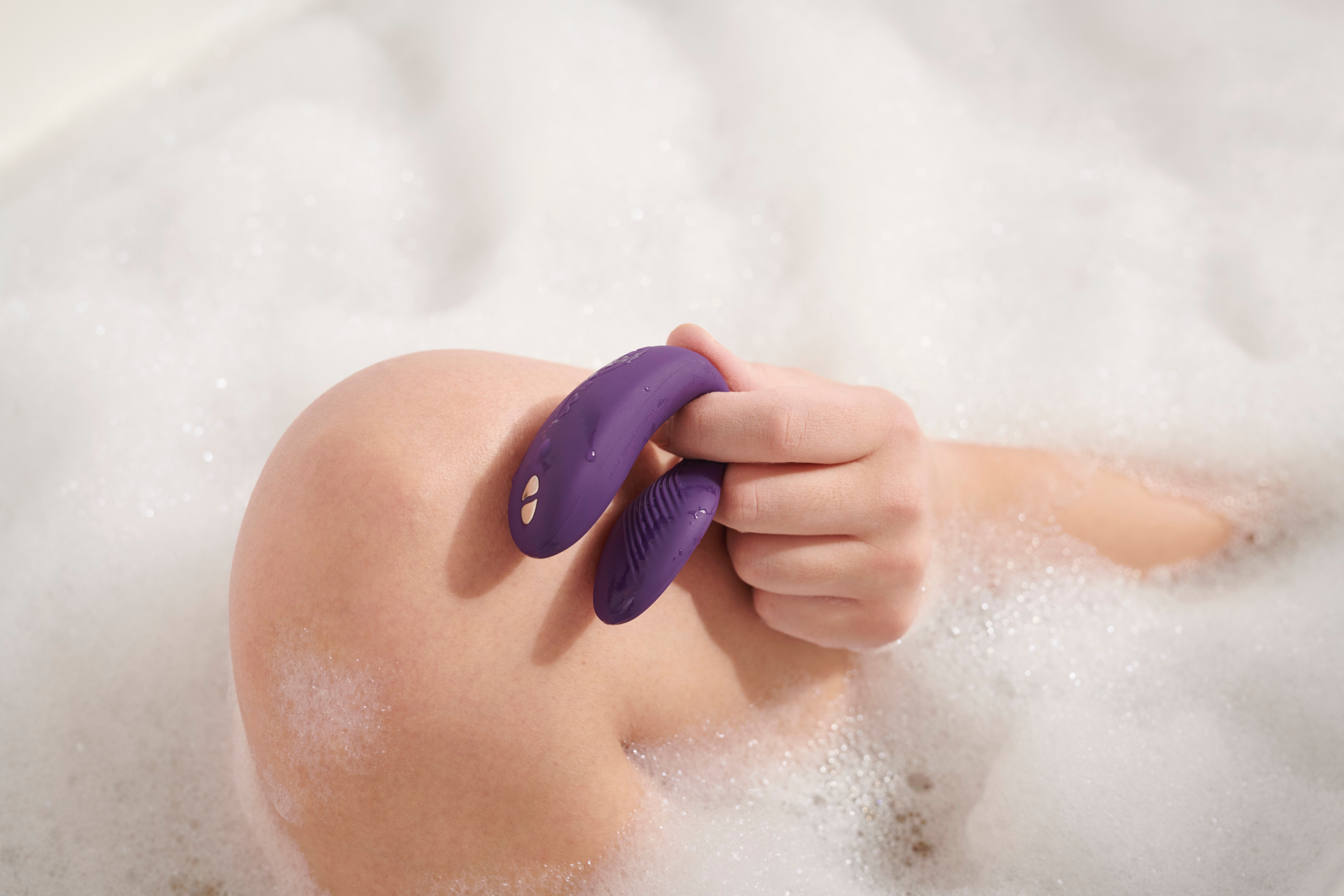 person holding couples vibrator in the bathtub?width=698&height=466&fit=crop&auto=webp&dpr=4