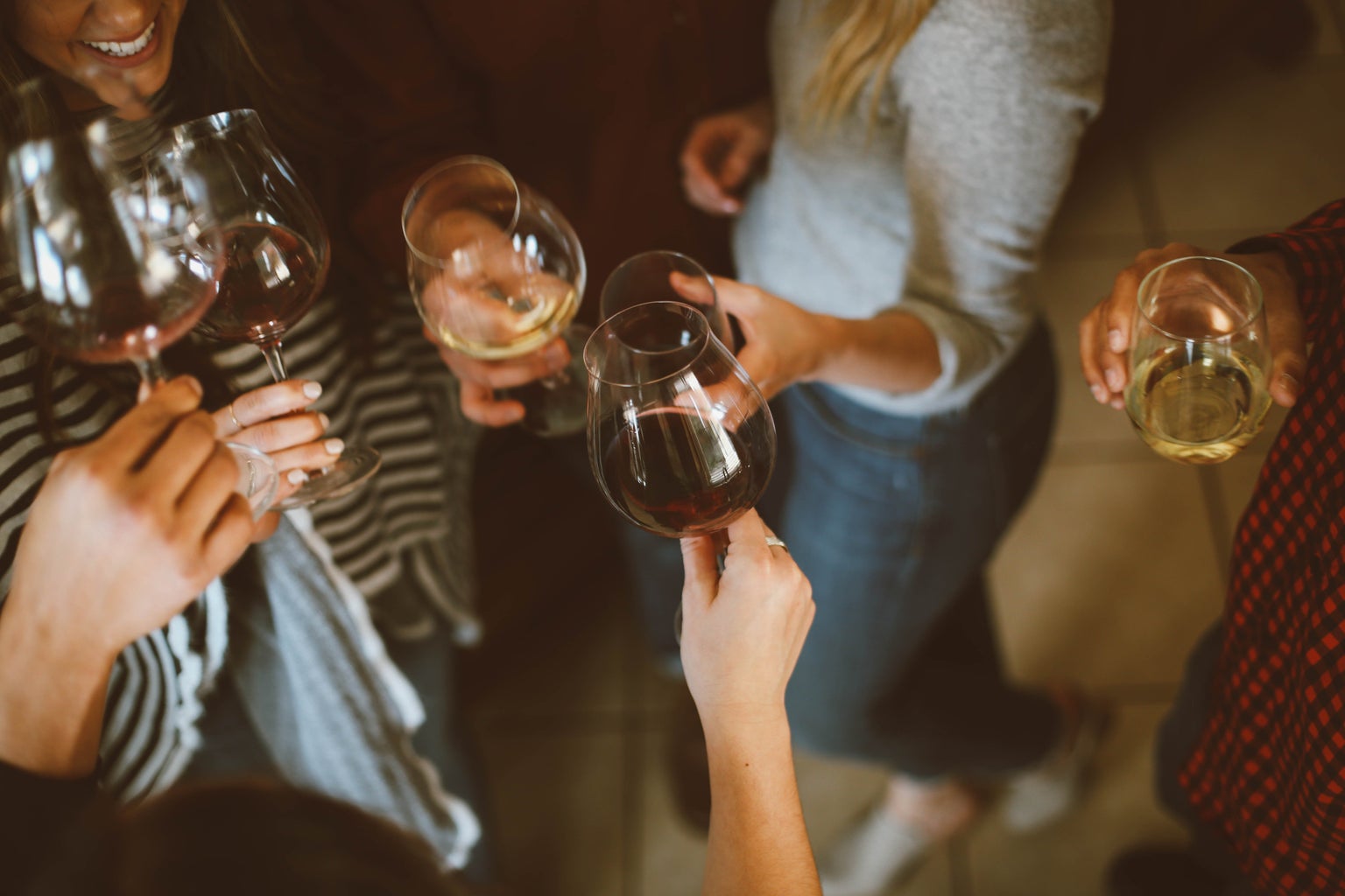 Girls clinking wine glasses