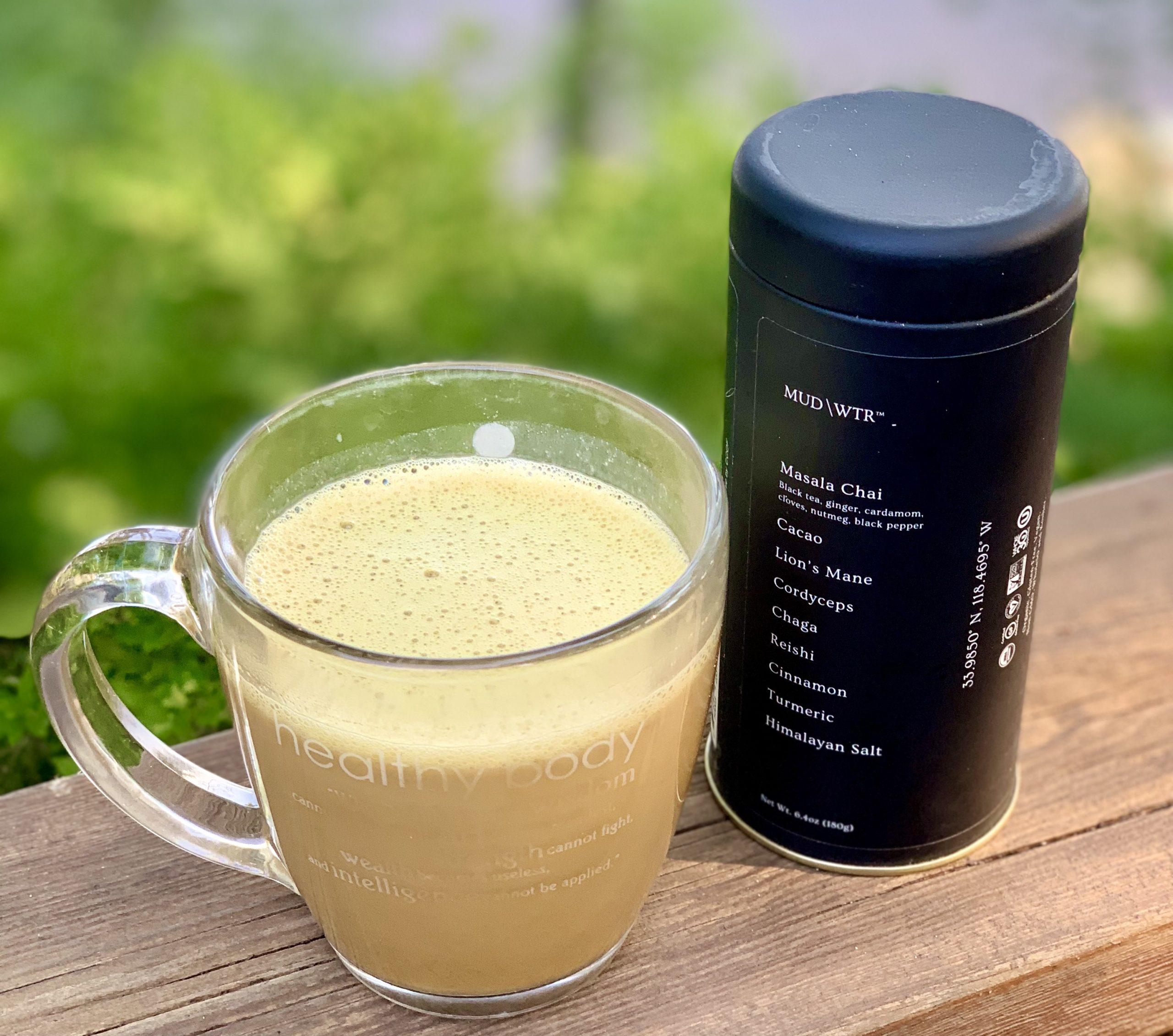 MUD\\WATR coffee mix next to cup of coffee