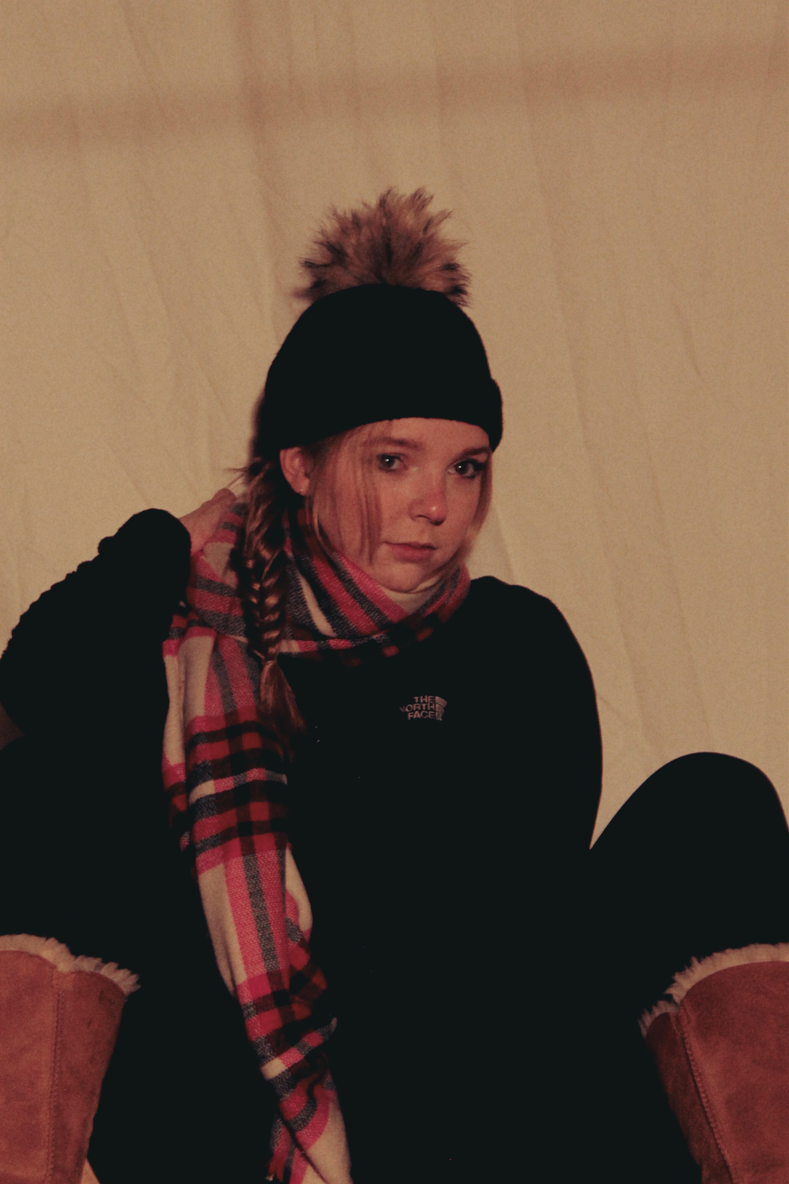 Woman from the 2010s in front of white backdrop