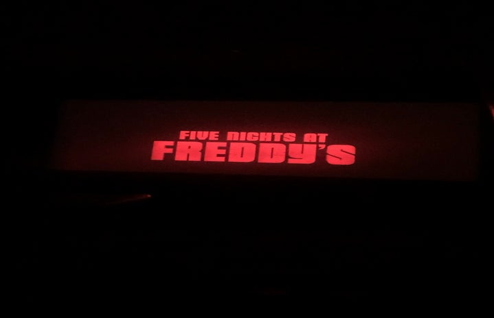 picture of the movie title, \"Five Nights at Freddy\'s\" at a theater