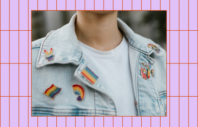 pride month pins on a denim jacket
