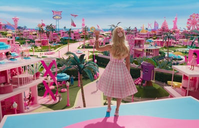 margot robbie waving to barbieland in barbie movie