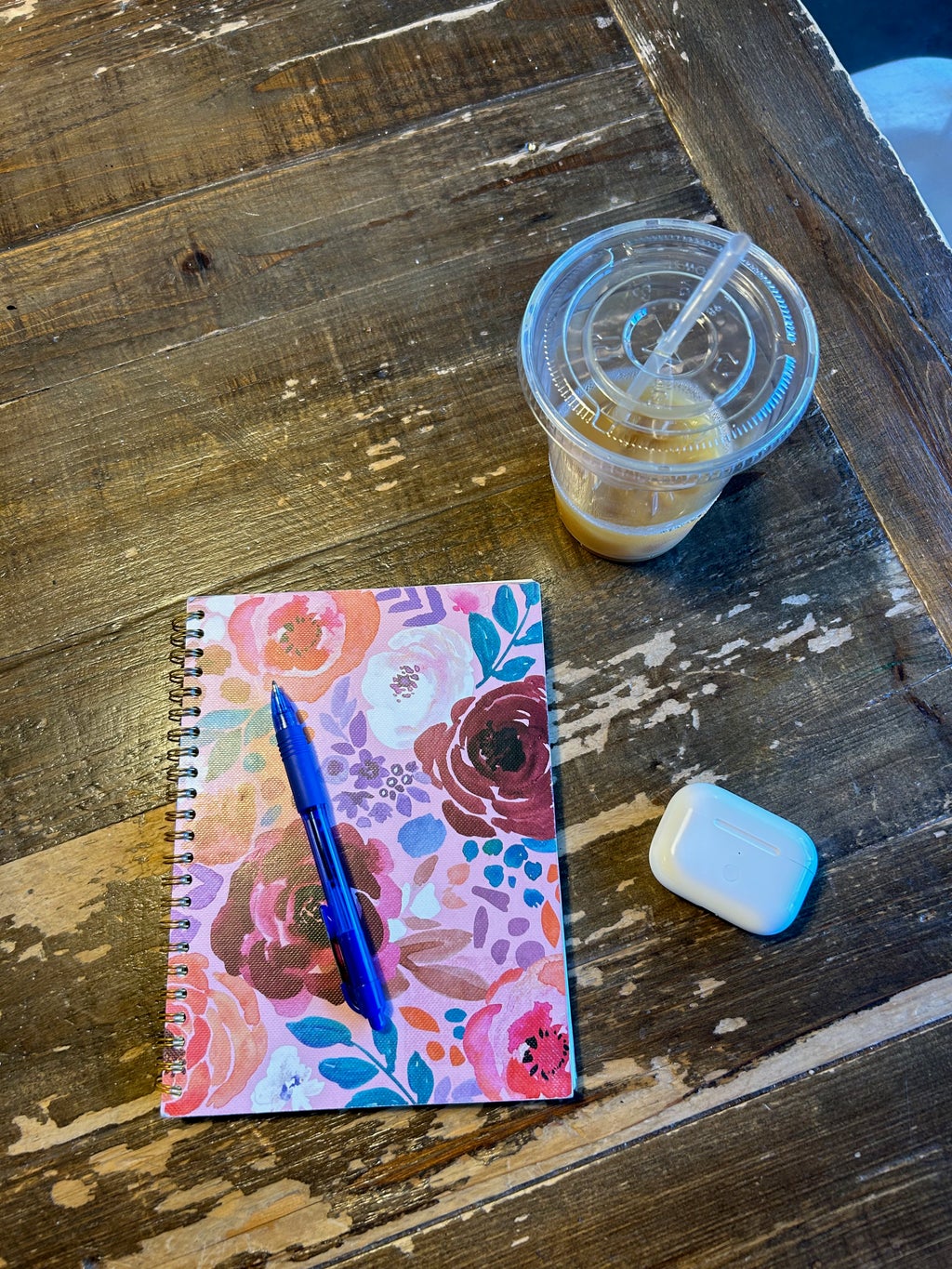 notebook and coffee on table