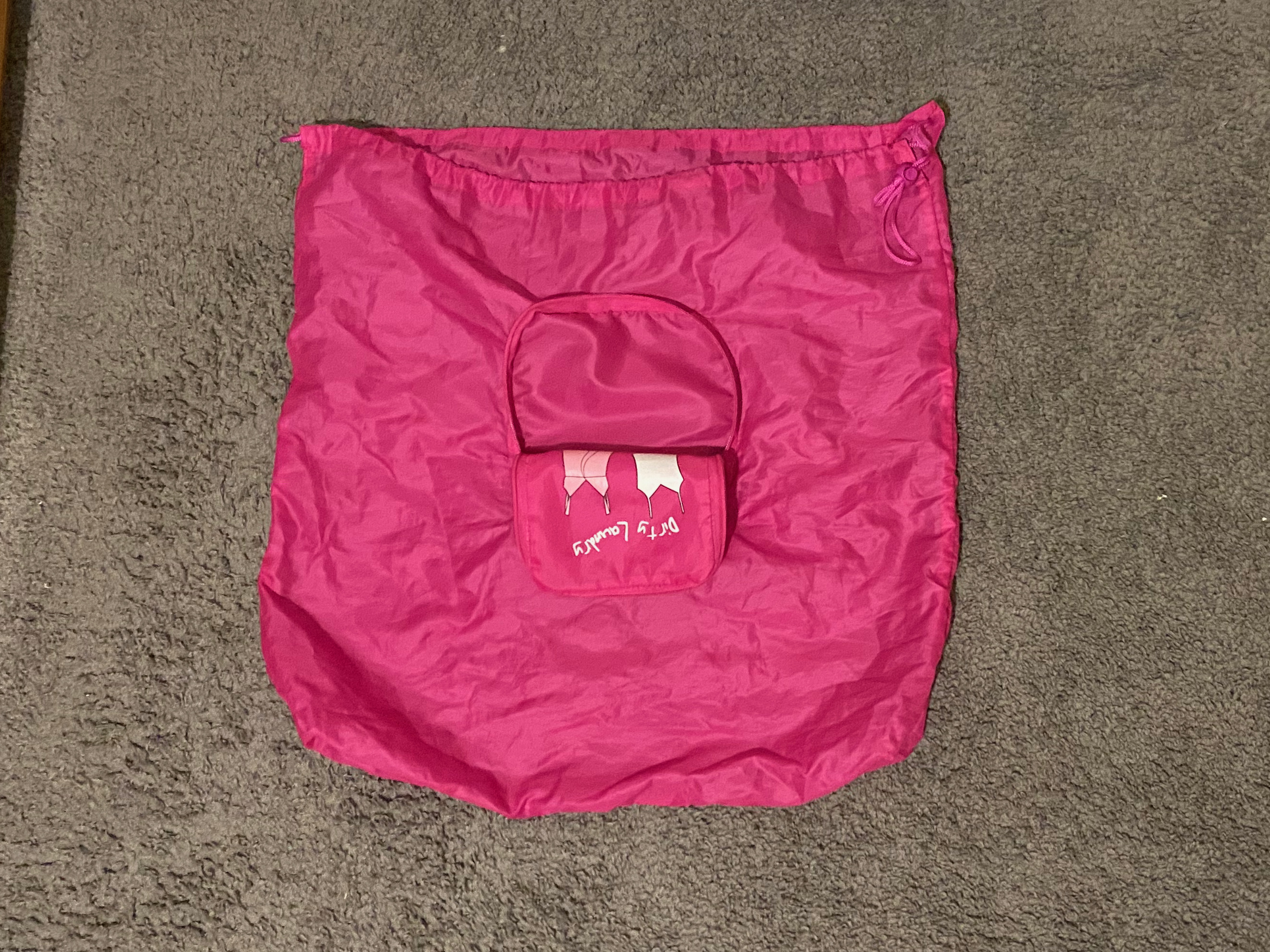 An unfolded and opened travel laundry bag