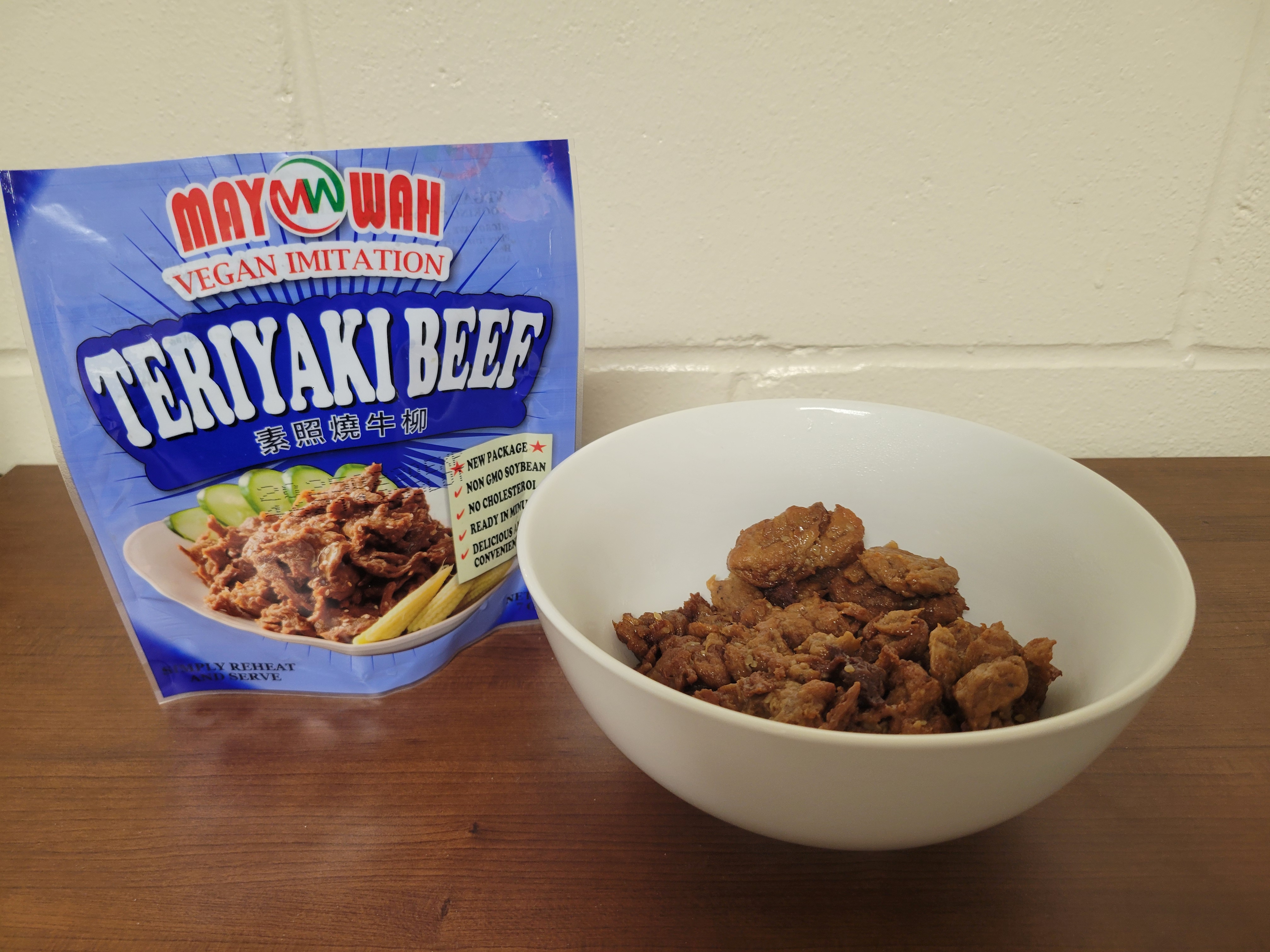 Vegan meat in a bowl with the bag next to it