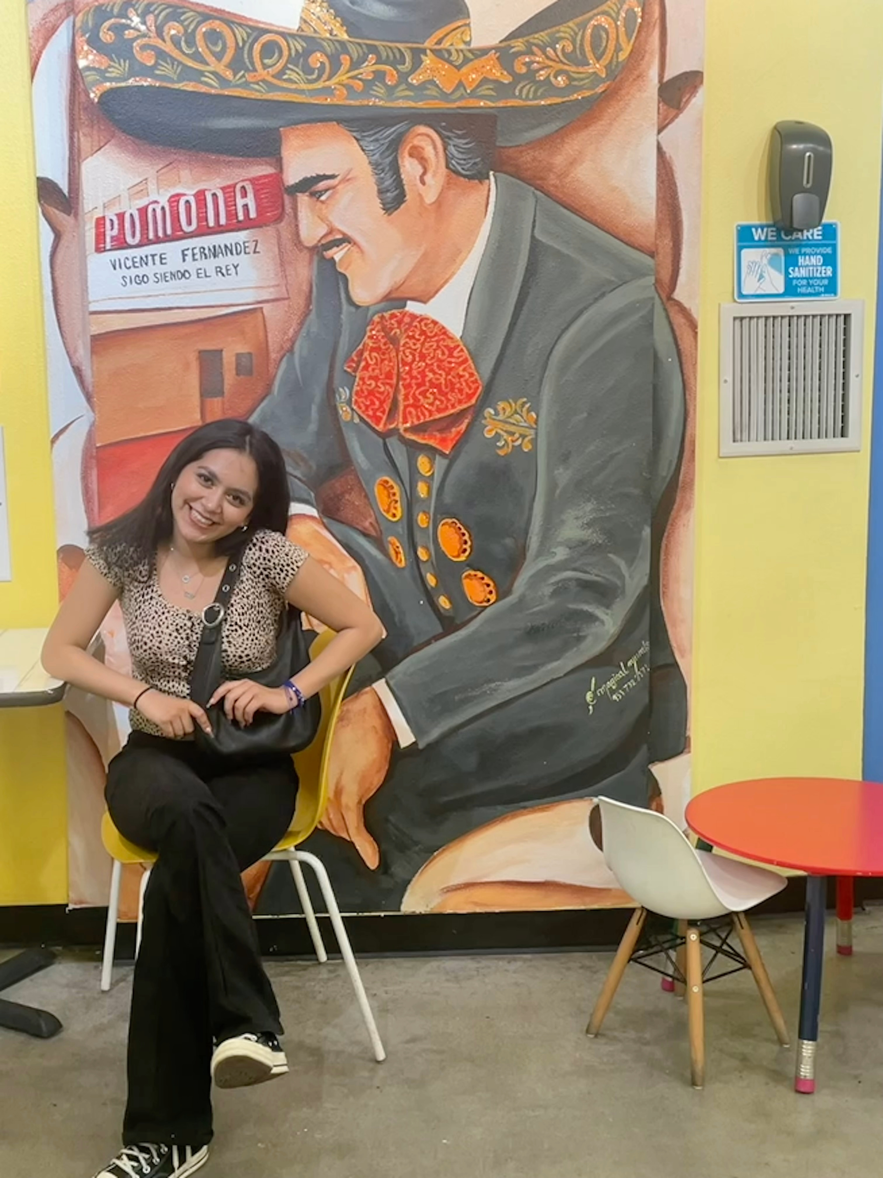 Author next to mural of singer referenced in article (Vicente Fernandez)
