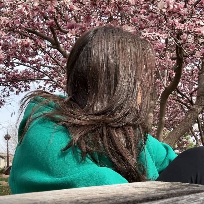 Girl outside by a magnolia tree