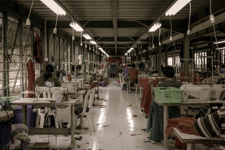 workers in factory displaying the working conditions in the fast fashion industry
