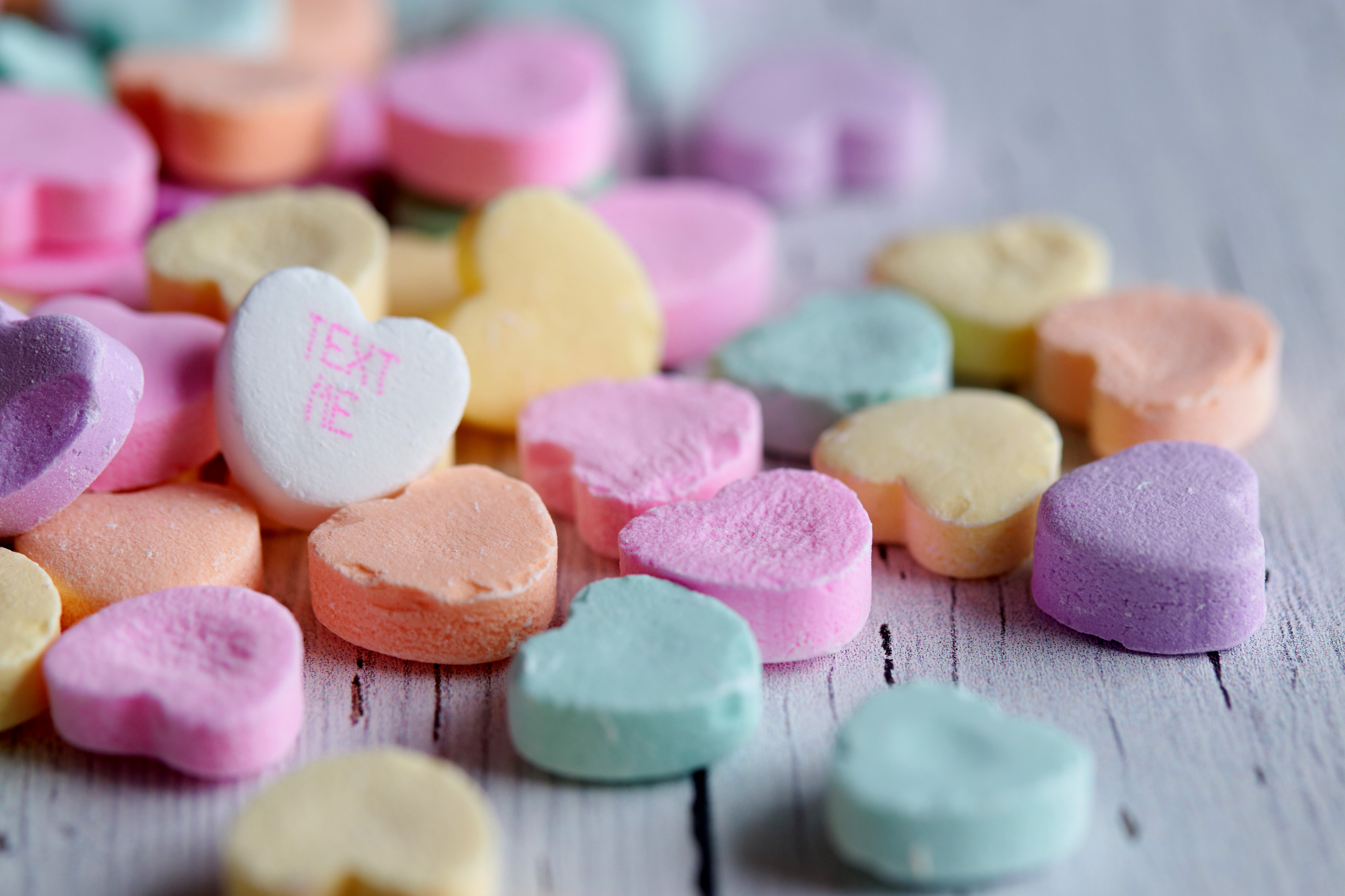 candy hearts, one of them says \"text me\"