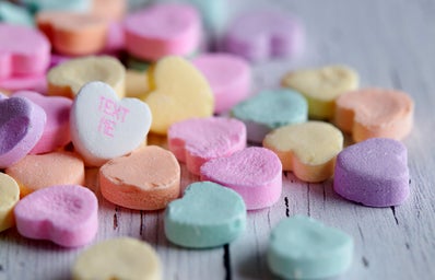candy hearts, one of them says \"text me\"