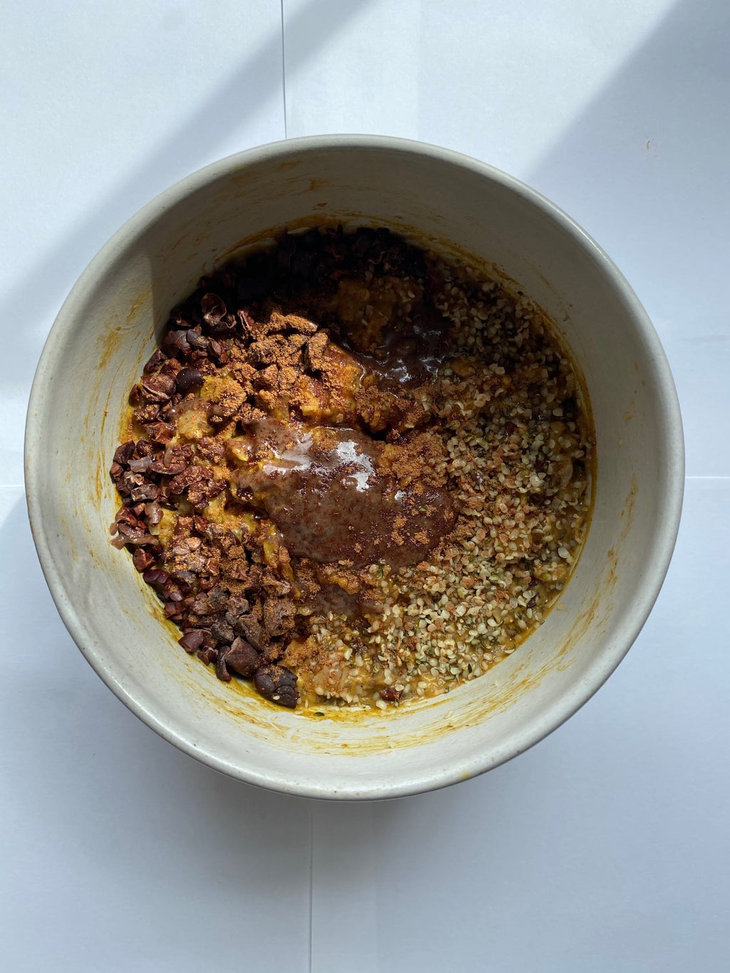 dorm oatmeal with spices, nut butter, and chocolate pieces