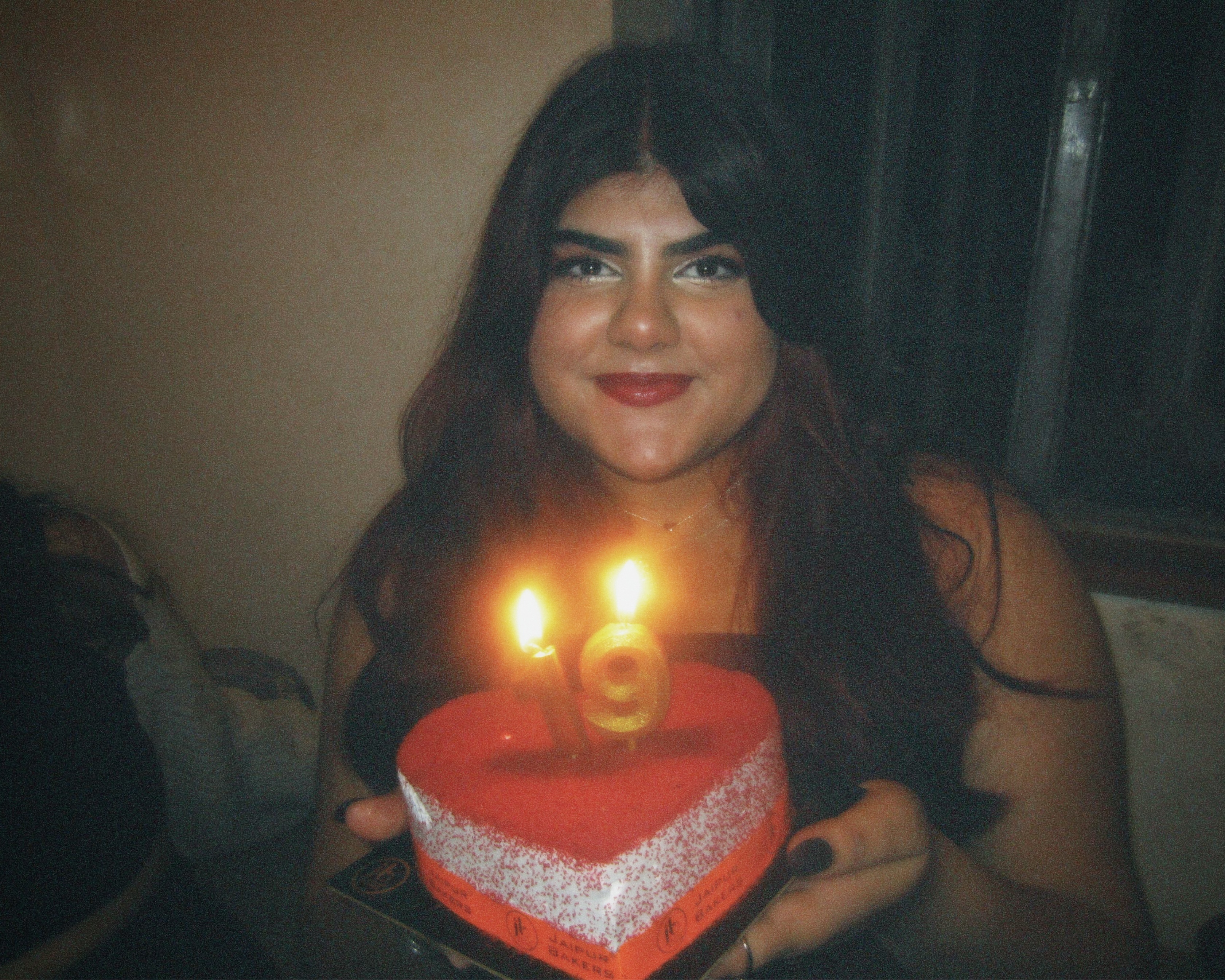 Picture of girl (me) with red velvet cake and \