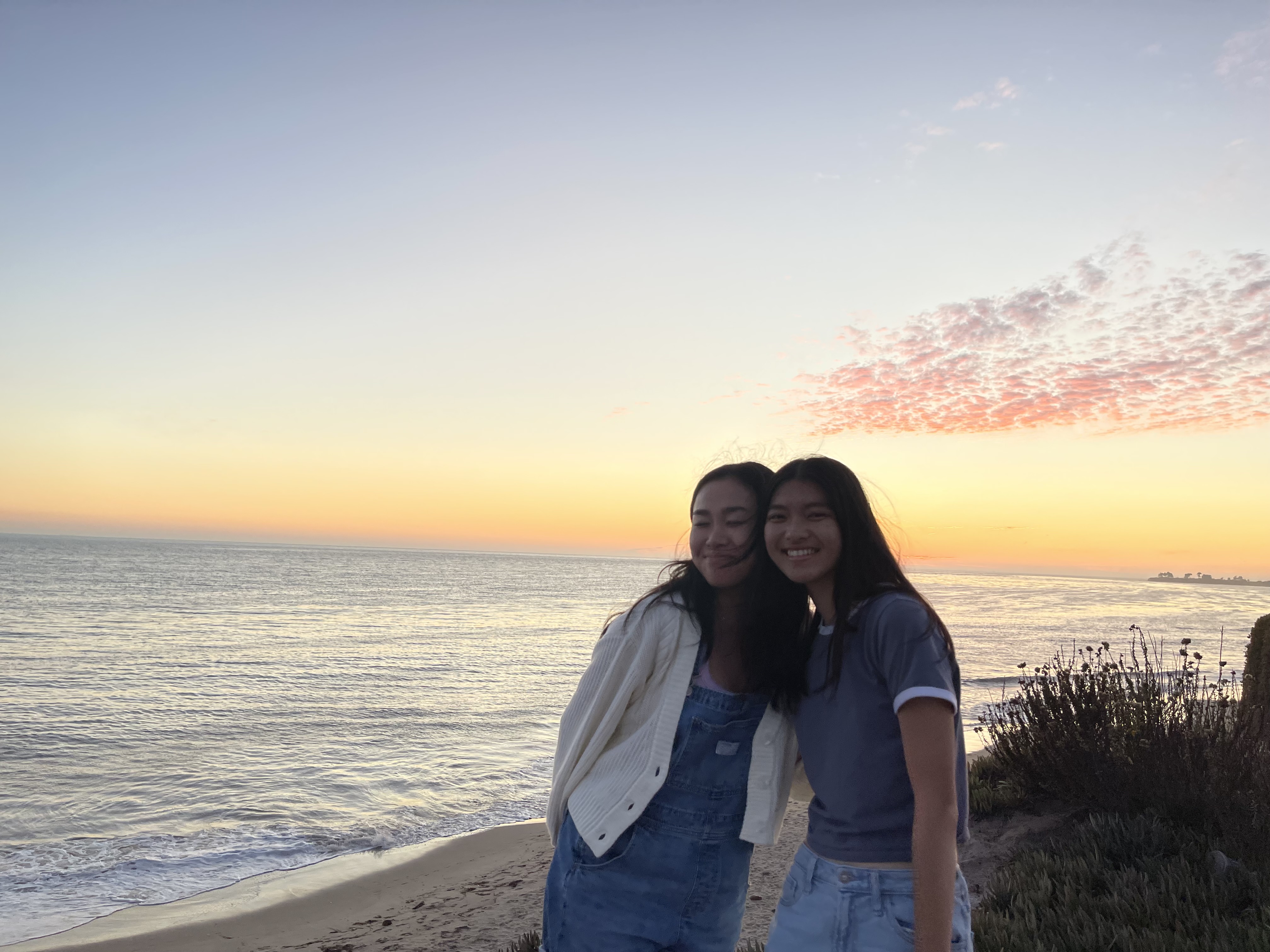 two friends hanging out at the beach