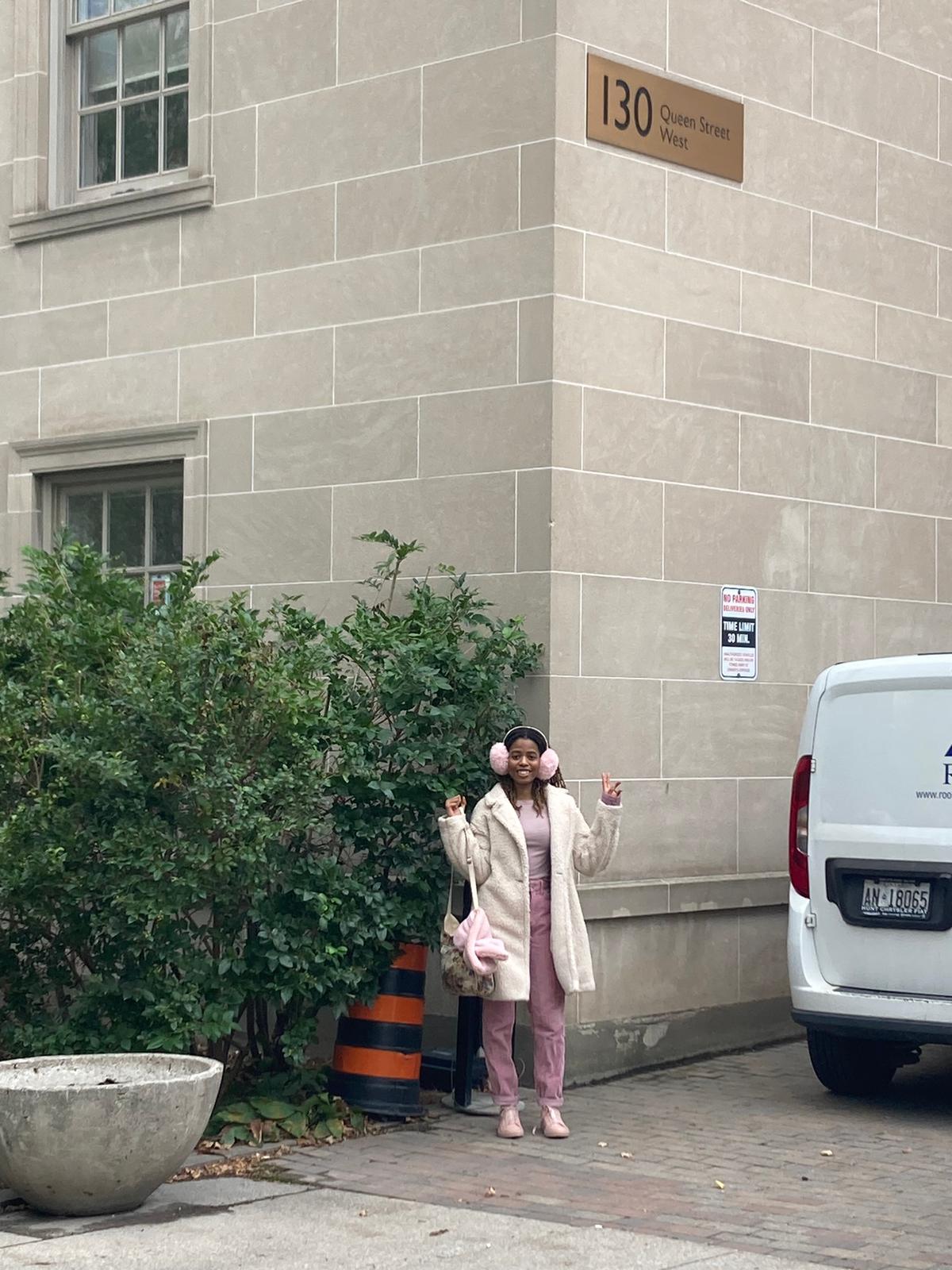 Girl in front of building