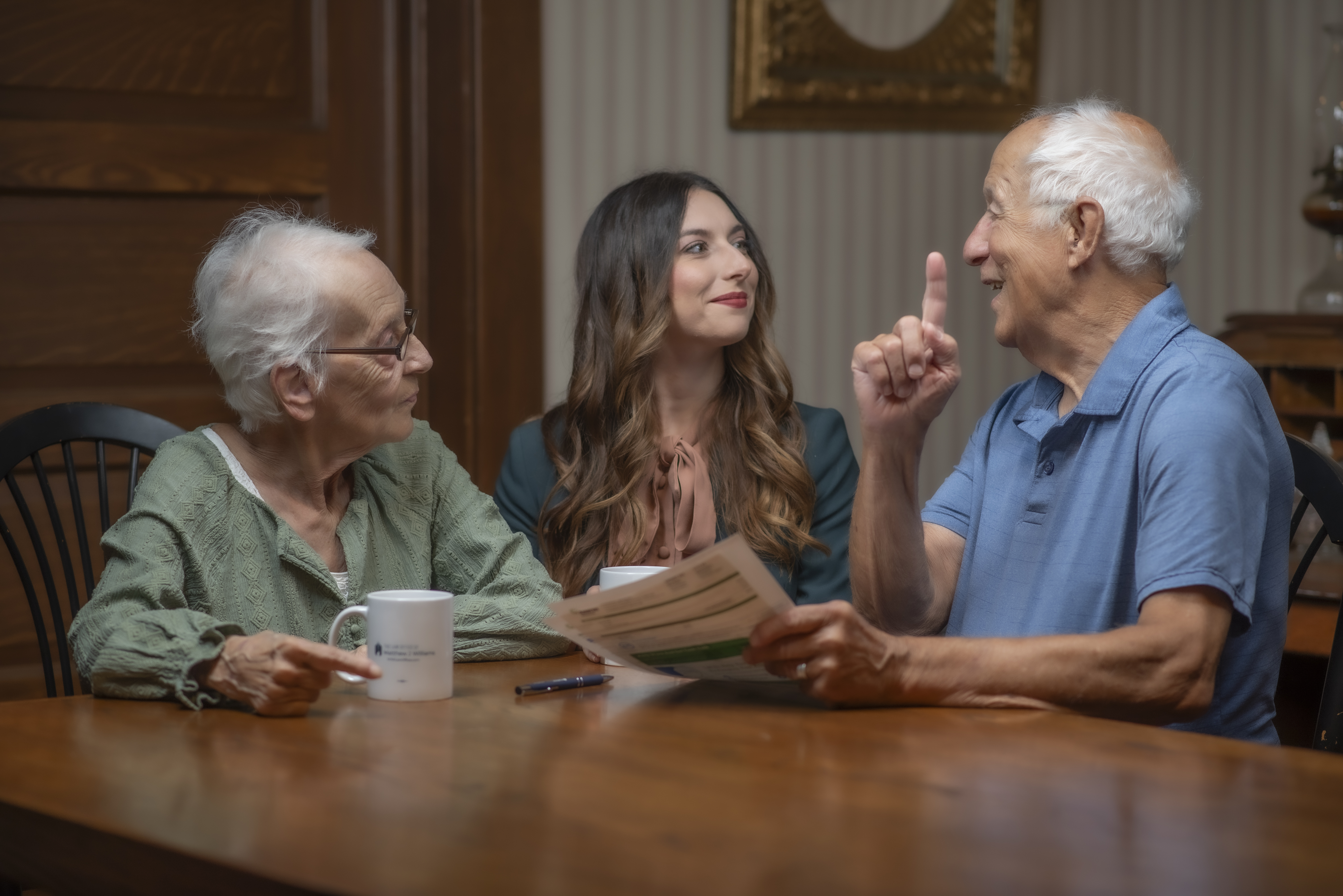 Cat Clayton speaking to older couple