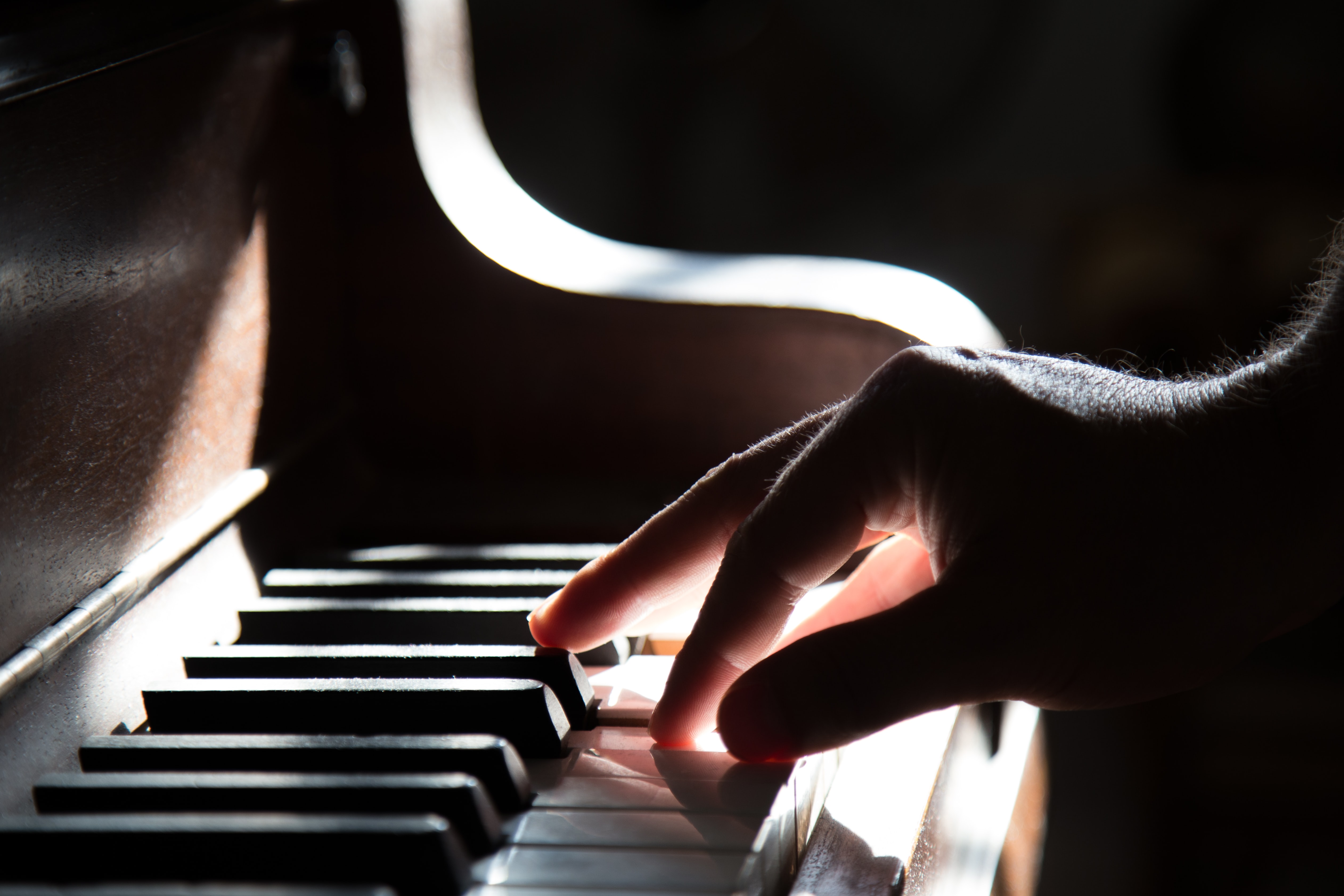 playing piano by Tadas Mikuckis on Unsplash