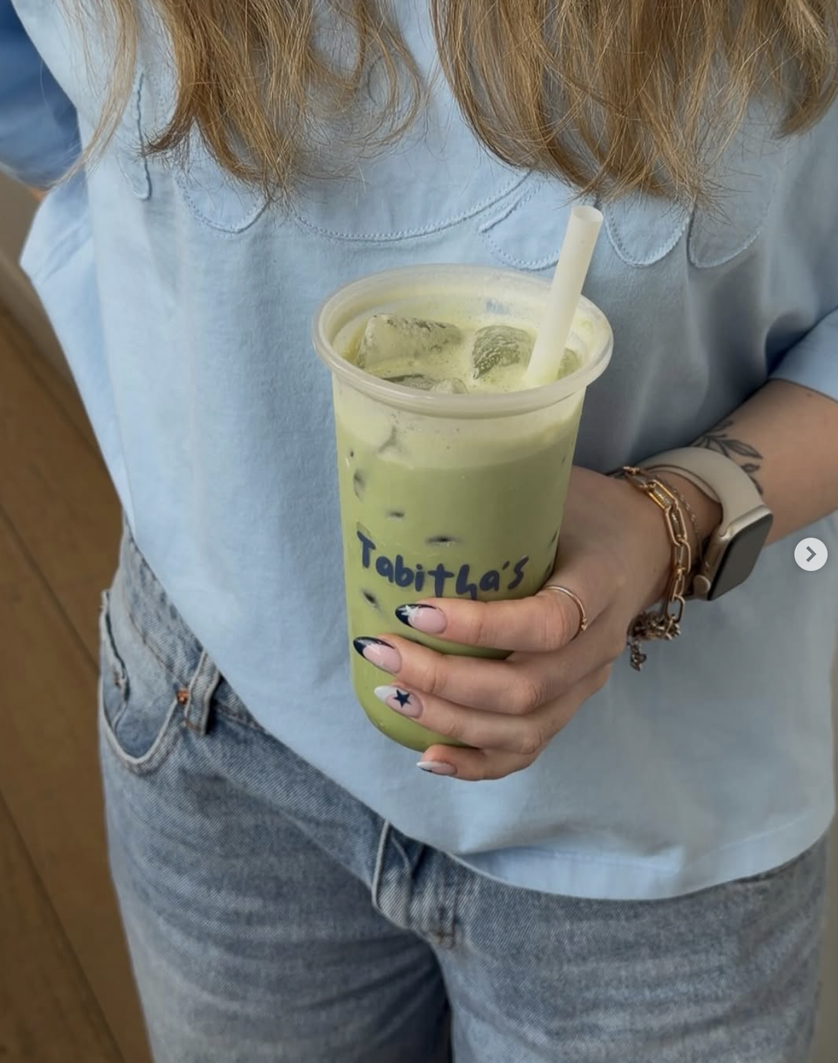 first photo on March 3rd Carousel - holding Tabitha’s matcha in blue tee