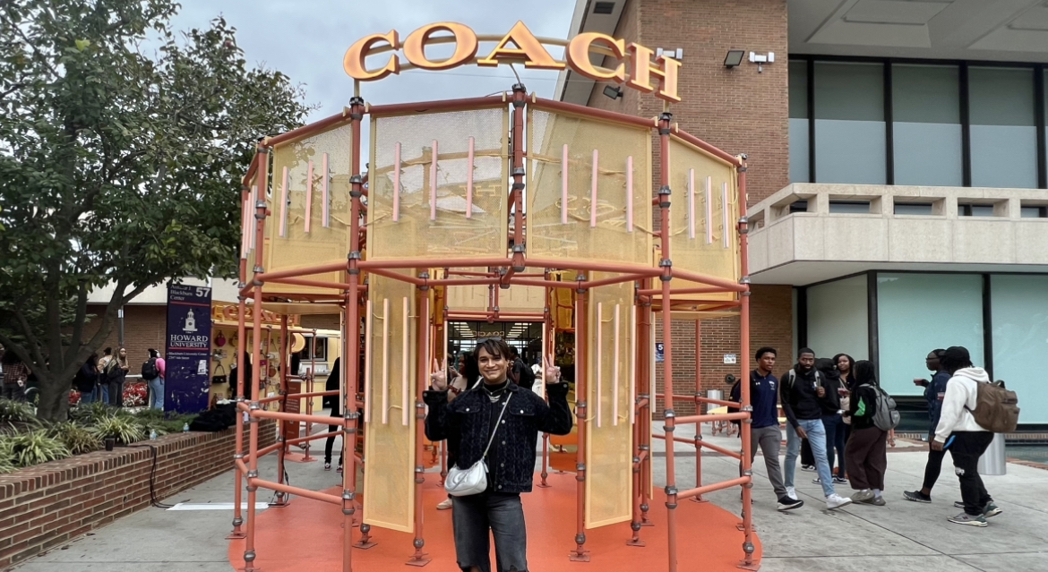 Shane Jesudason welcomes students into Coach #WearYourShine mirror for selfies.