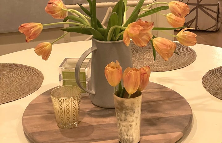 tulips in a vase on a white round table