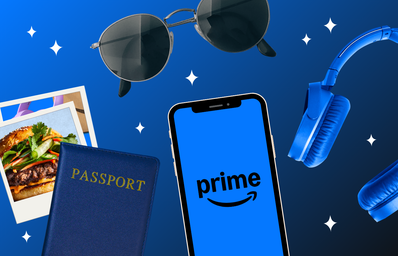 stack of photos, passport, sunglasses, smartphone with Prime logo, and headphones on a blue background