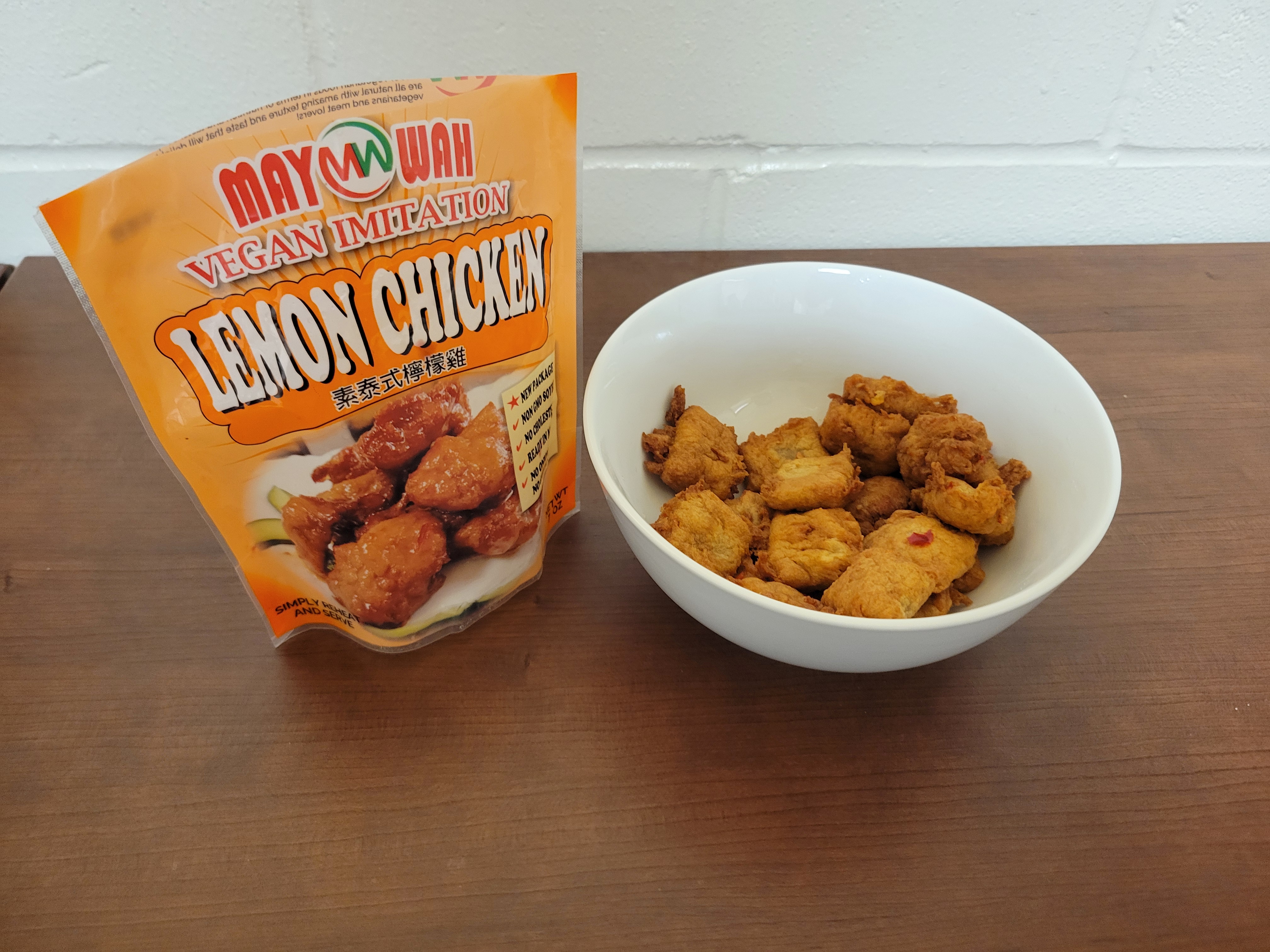 Vegan meat in a bowl with the bag next to it