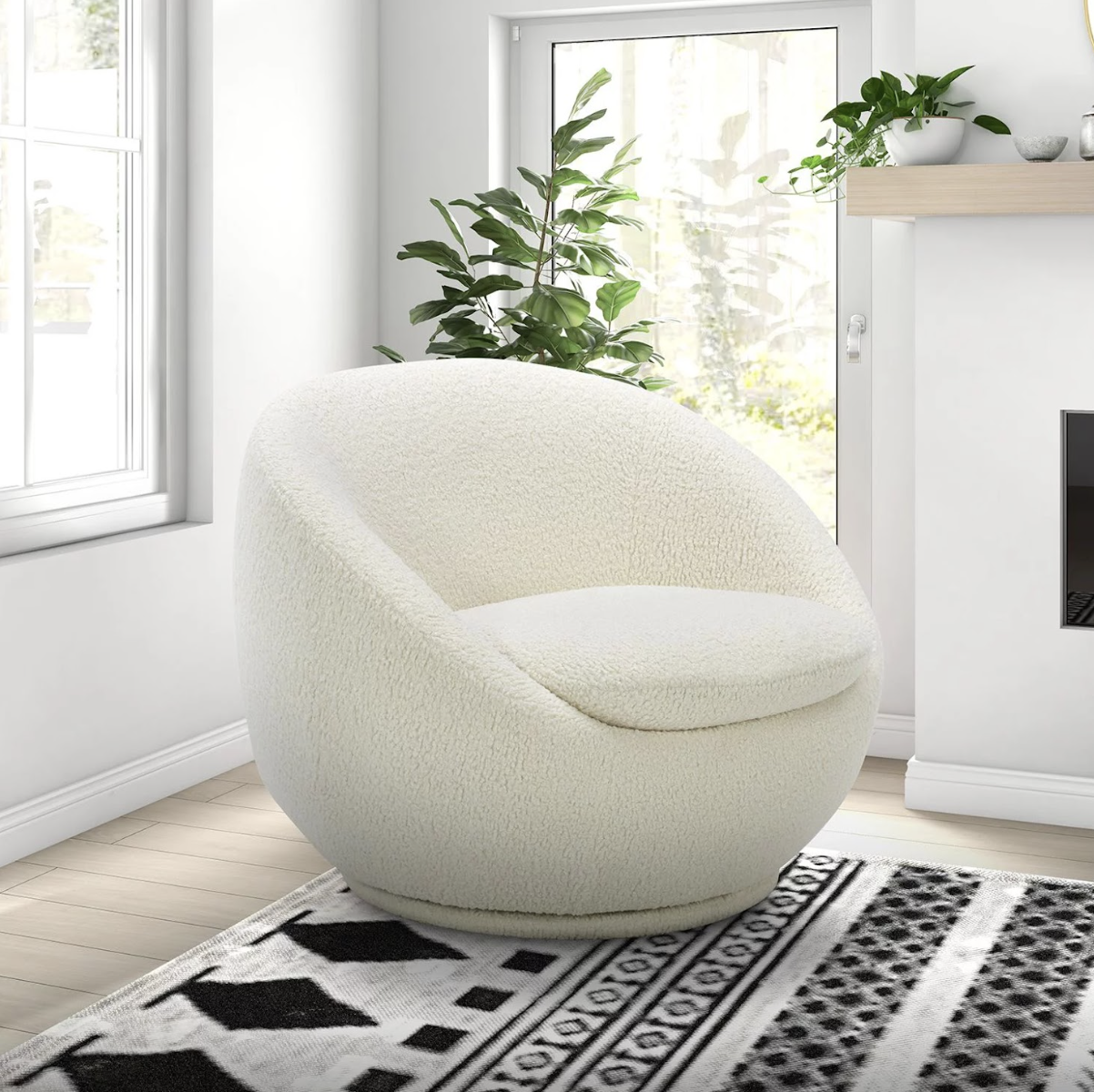 white plush chair on a black and white rug