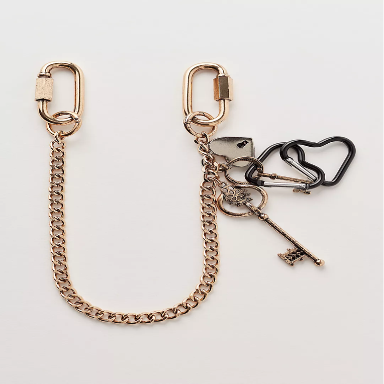 A gold chain bag charm