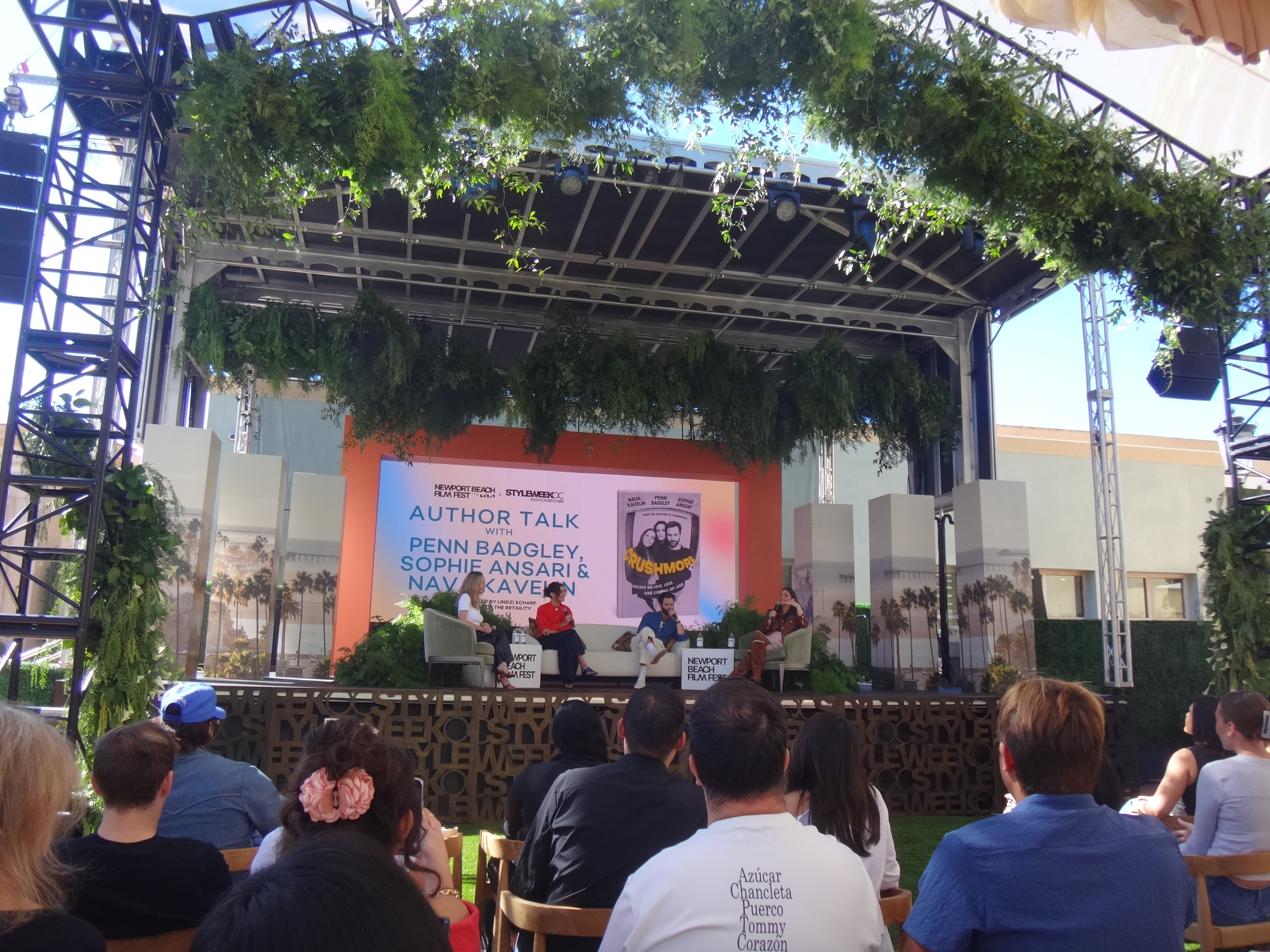 Three speakers on a stage