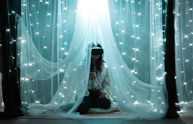 Girl using VR headset under canopy