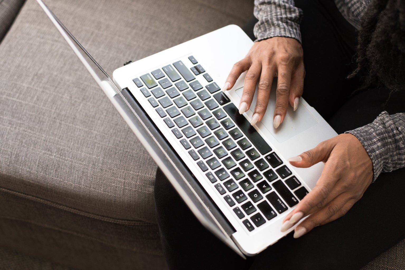 woman typing on laptop