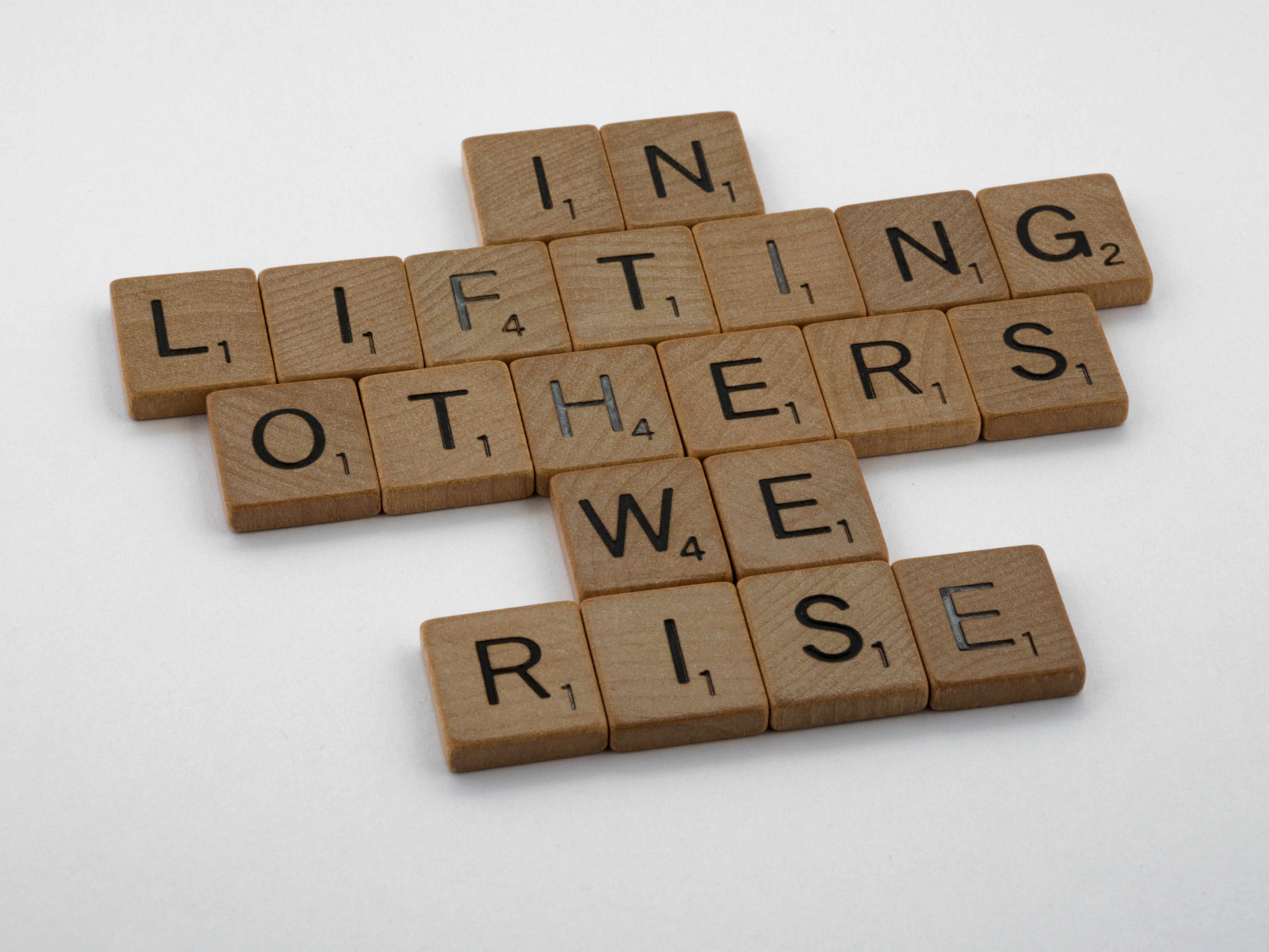 in lifting others we rise Brett Jordan on Unsplash