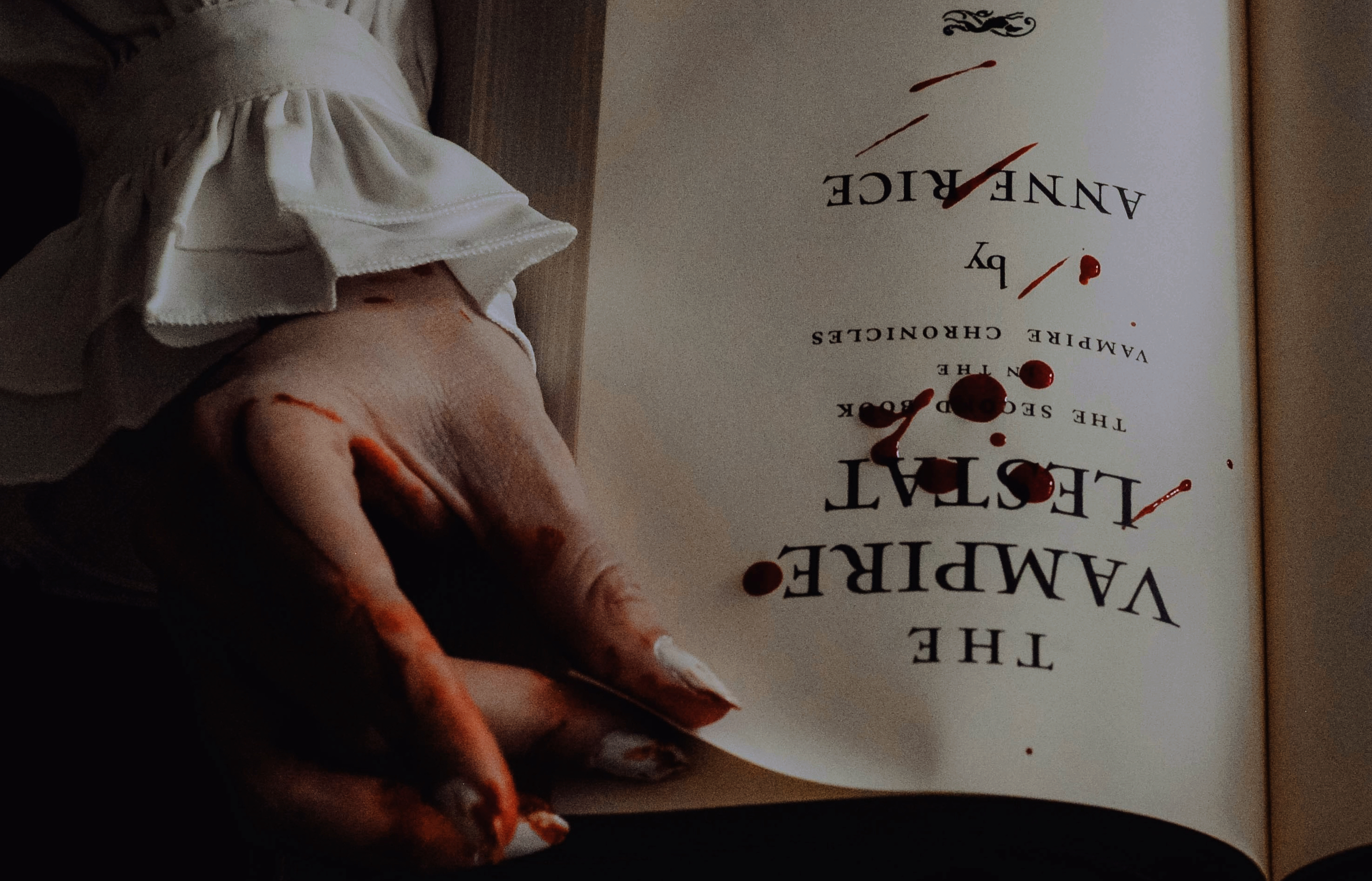 a person holding a book open with their hand