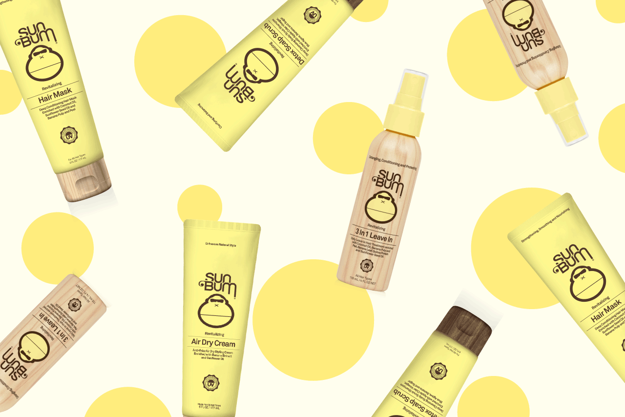 Hair care bottles on a yellow polka dotted background