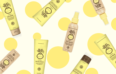 Hair care bottles on a yellow polka dotted background