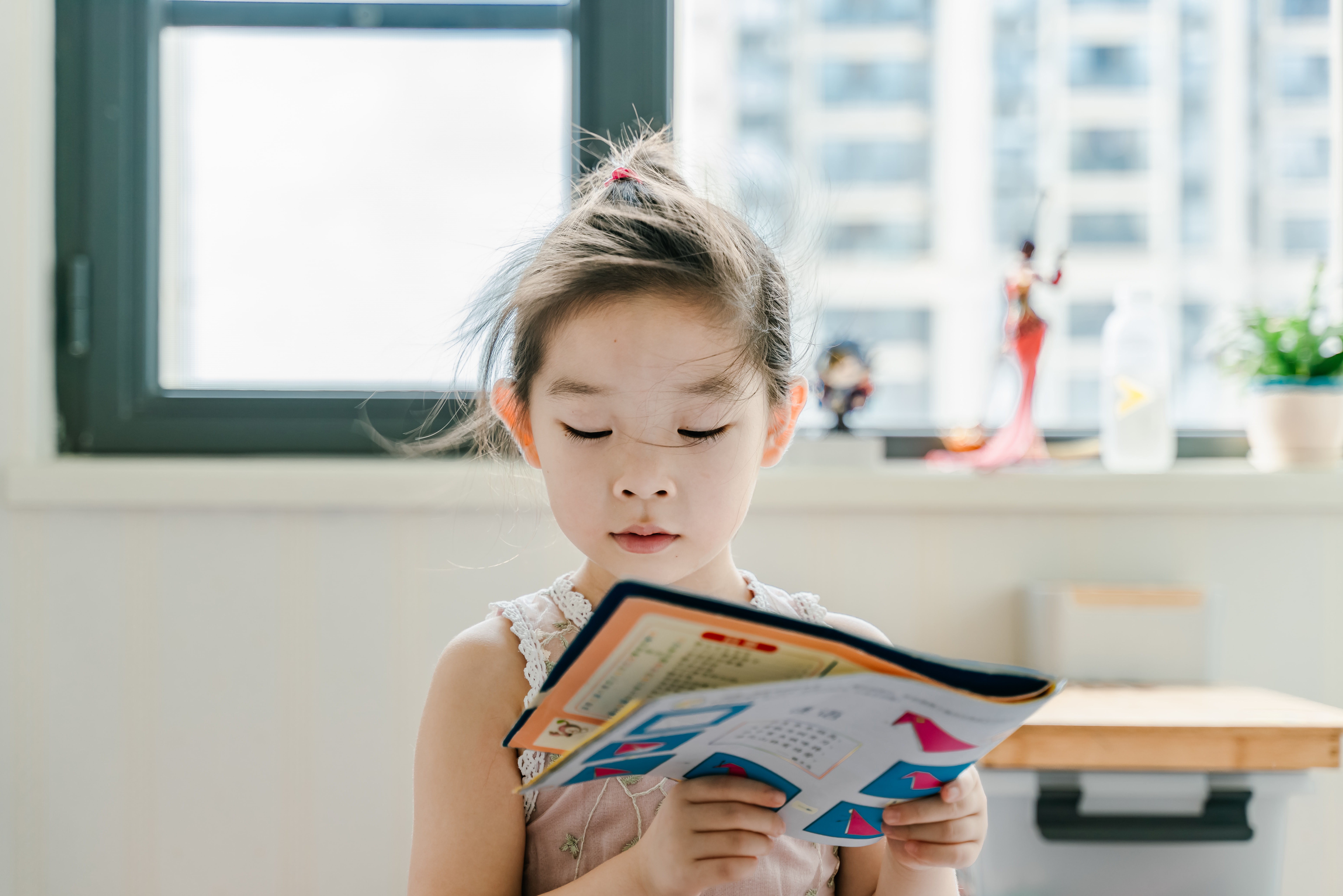 young girl reading a book