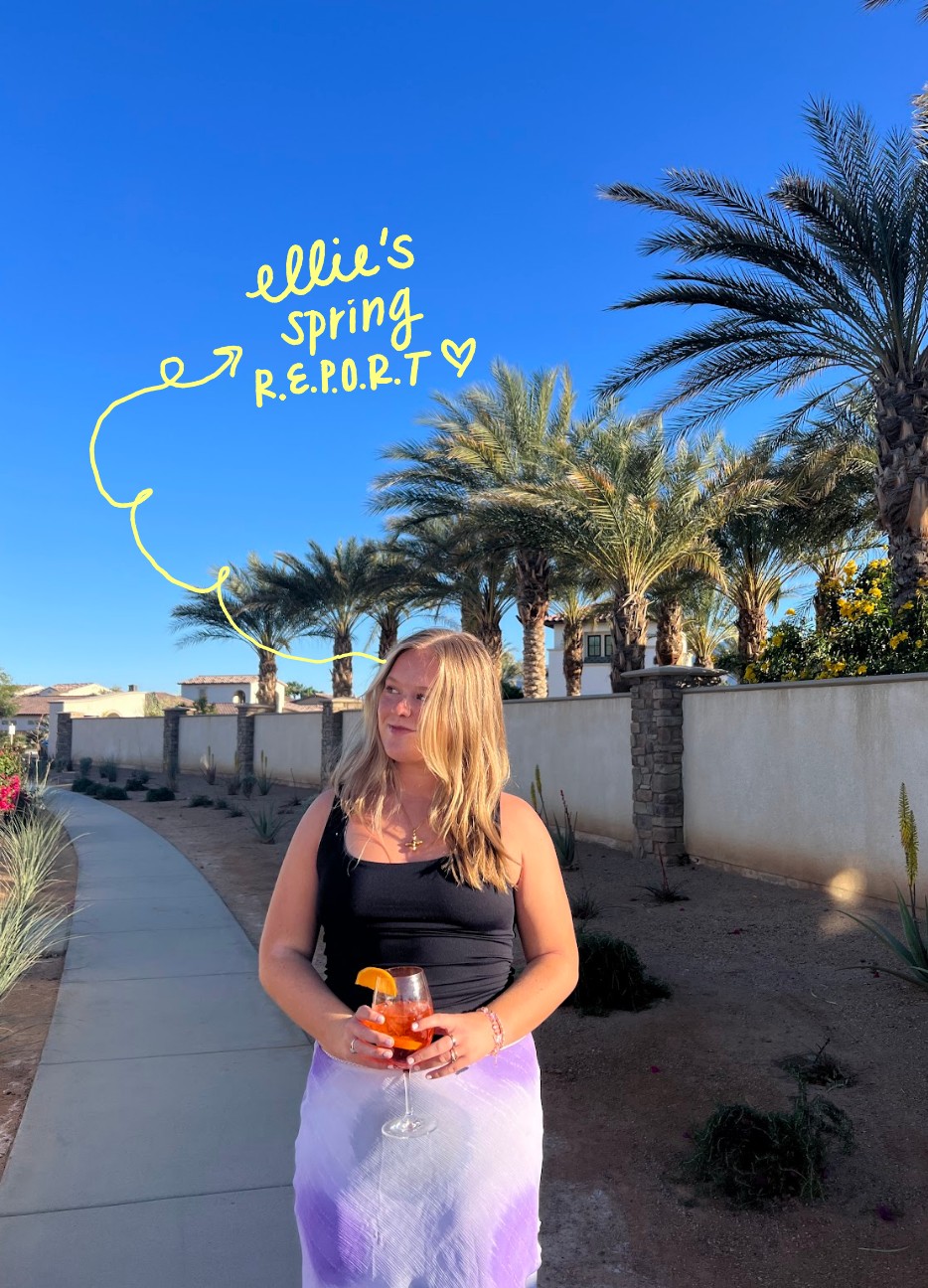 girl with a wine glass wearing a purple skirt