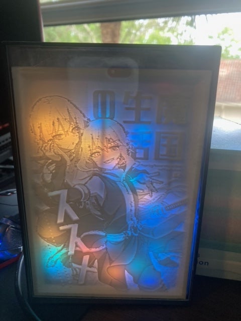 Lithophane I made for my brother\'s birthday with lights.