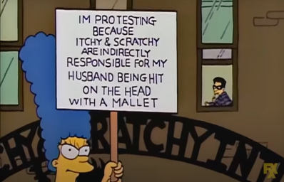 Marge holding a protest sign