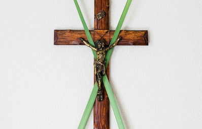 cross with palms behind it