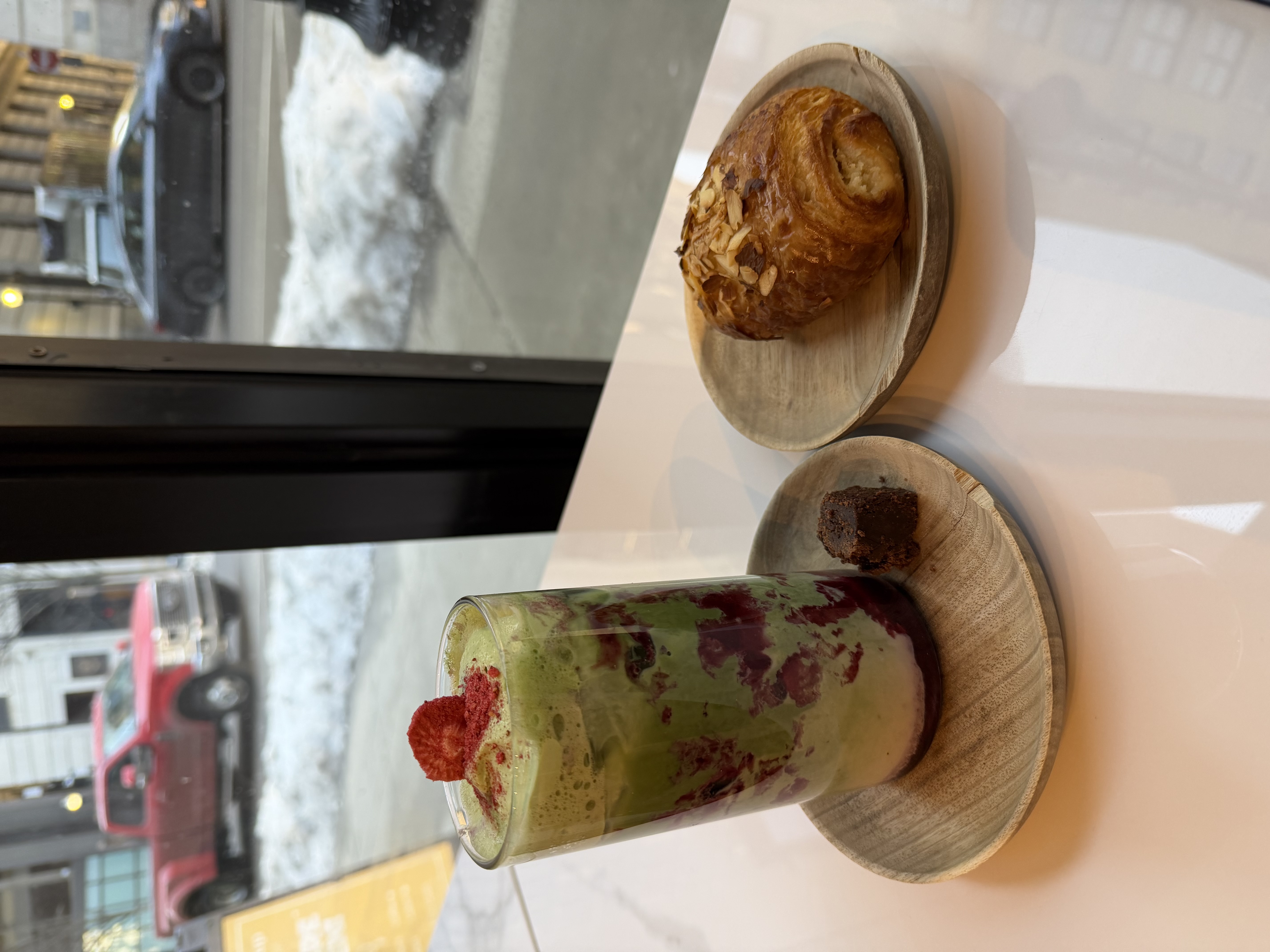 Picture of strawberry matcha latte and croissant