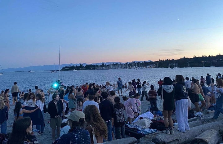 people at a beach post swimming sunset