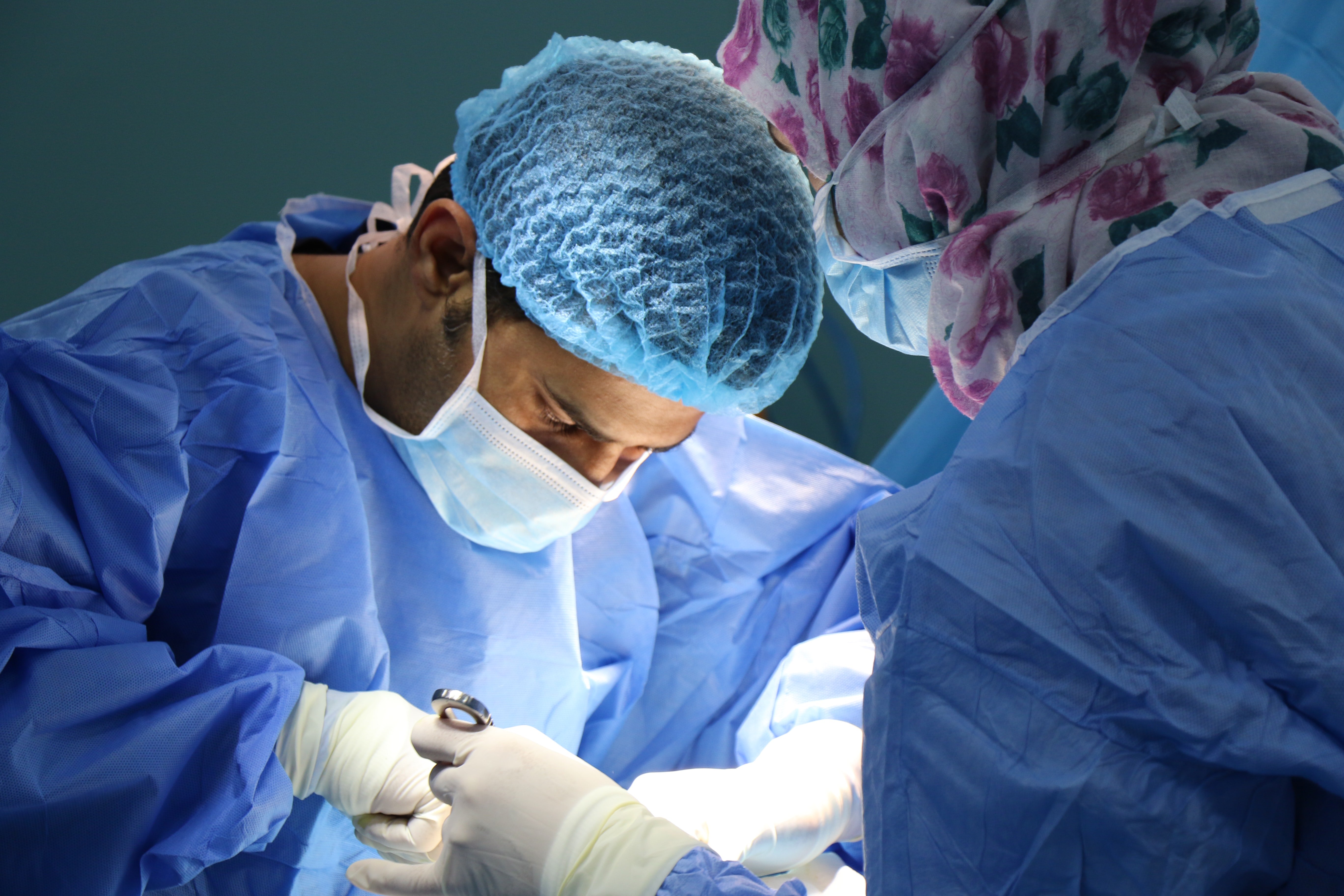 two surgeons performing an operation by Unsplash?width=698&height=466&fit=crop&auto=webp&dpr=4