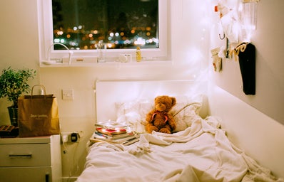 Dorm room teddybear on bed